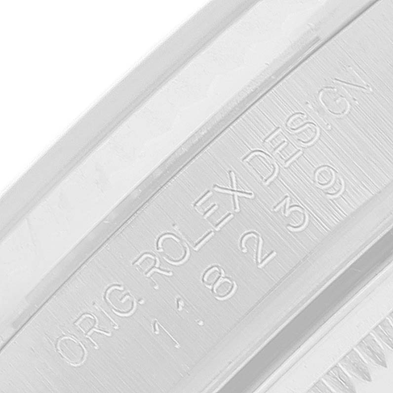 The image shows a close-up of the inner side of the caseback for the Rolex President 118239 Men's White Gold Silver Dial 118239 Men's White Gold Silver Dial model, featuring engraved text.