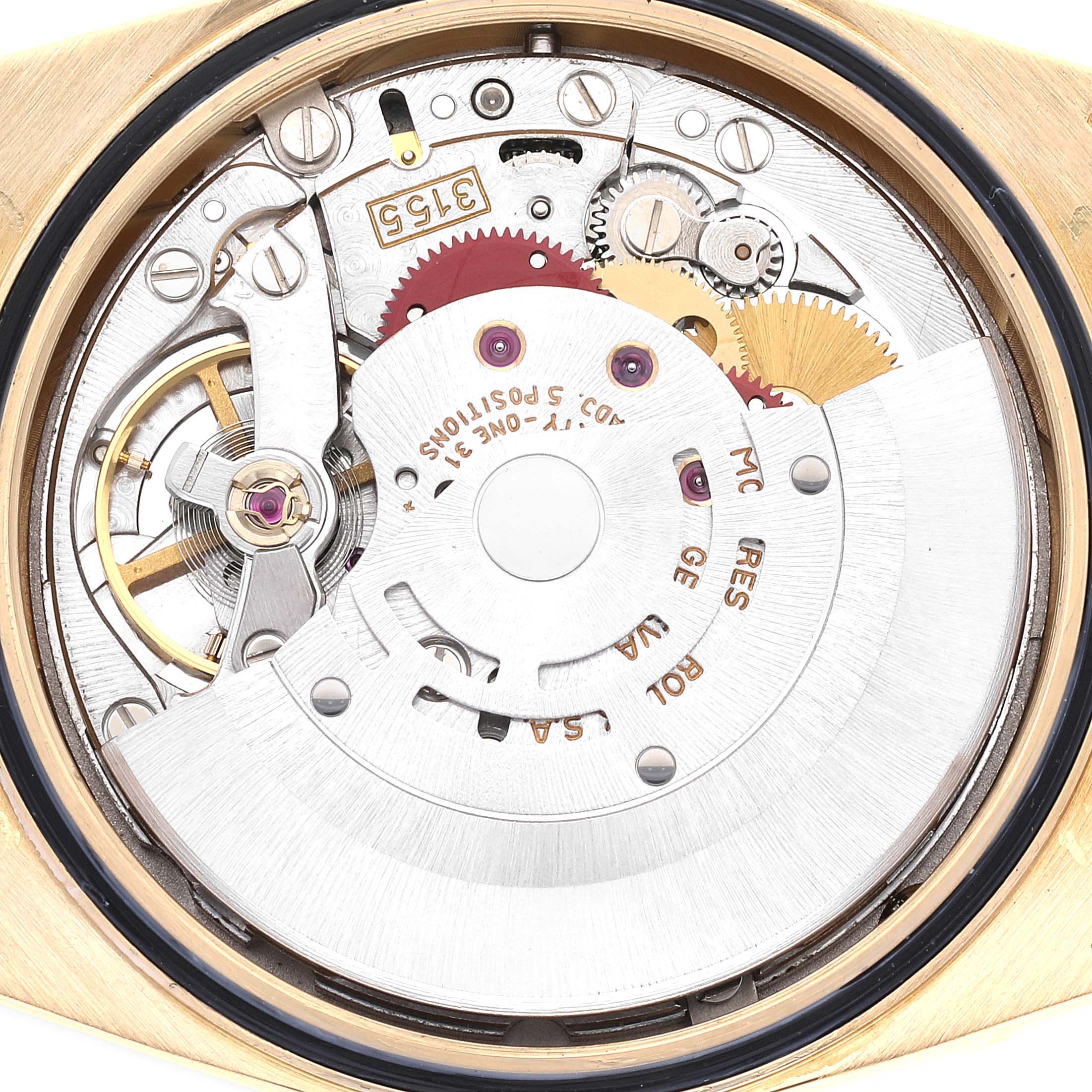 This image shows the internal mechanisms of a Rolex President 18238 Men's Yellow Gold Black Dial 18238 Men's Yellow Gold Black Dial model watch taken from a top-down angle.