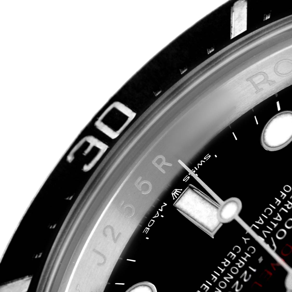 The image shows a close-up of the bezel and dial details of a Rolex Sea-Dweller 126600 Men's Stainless Steel Black Dial watch.
