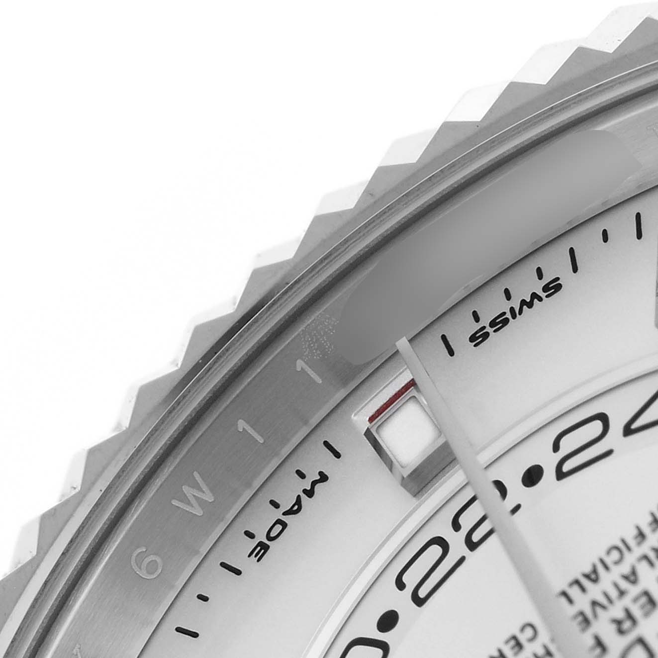 The image shows a close-up of the bezel and part of the dial of a Rolex Sky-Dweller 326934 Men's Stainless Steel Silver Dial, highlighting the month indicator.