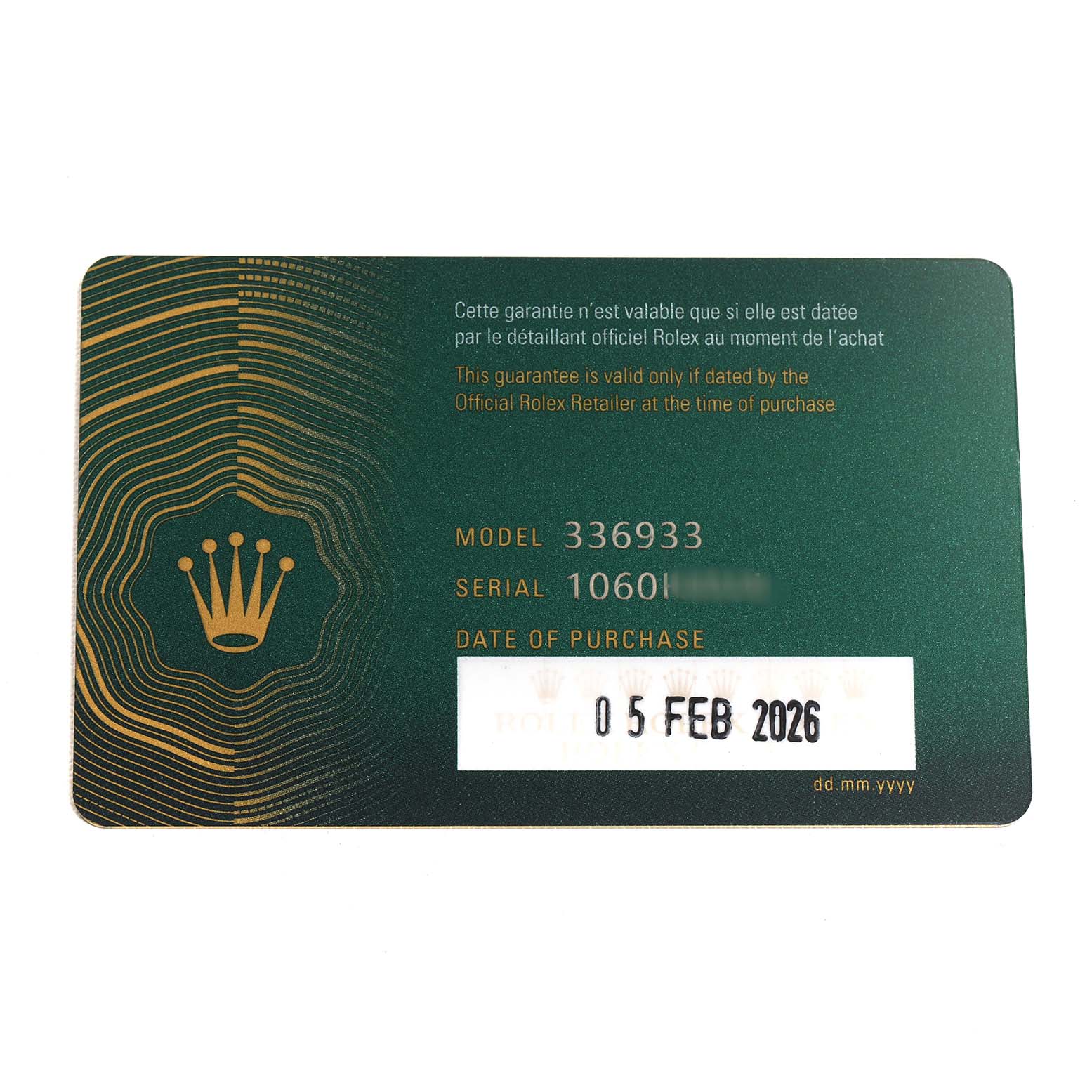 This image shows a guarantee card for a Rolex Sky-Dweller 336933 Men's Steel and Gold (two tone) Black Dial watch model, detailing model and serial numbers, and purchase date.