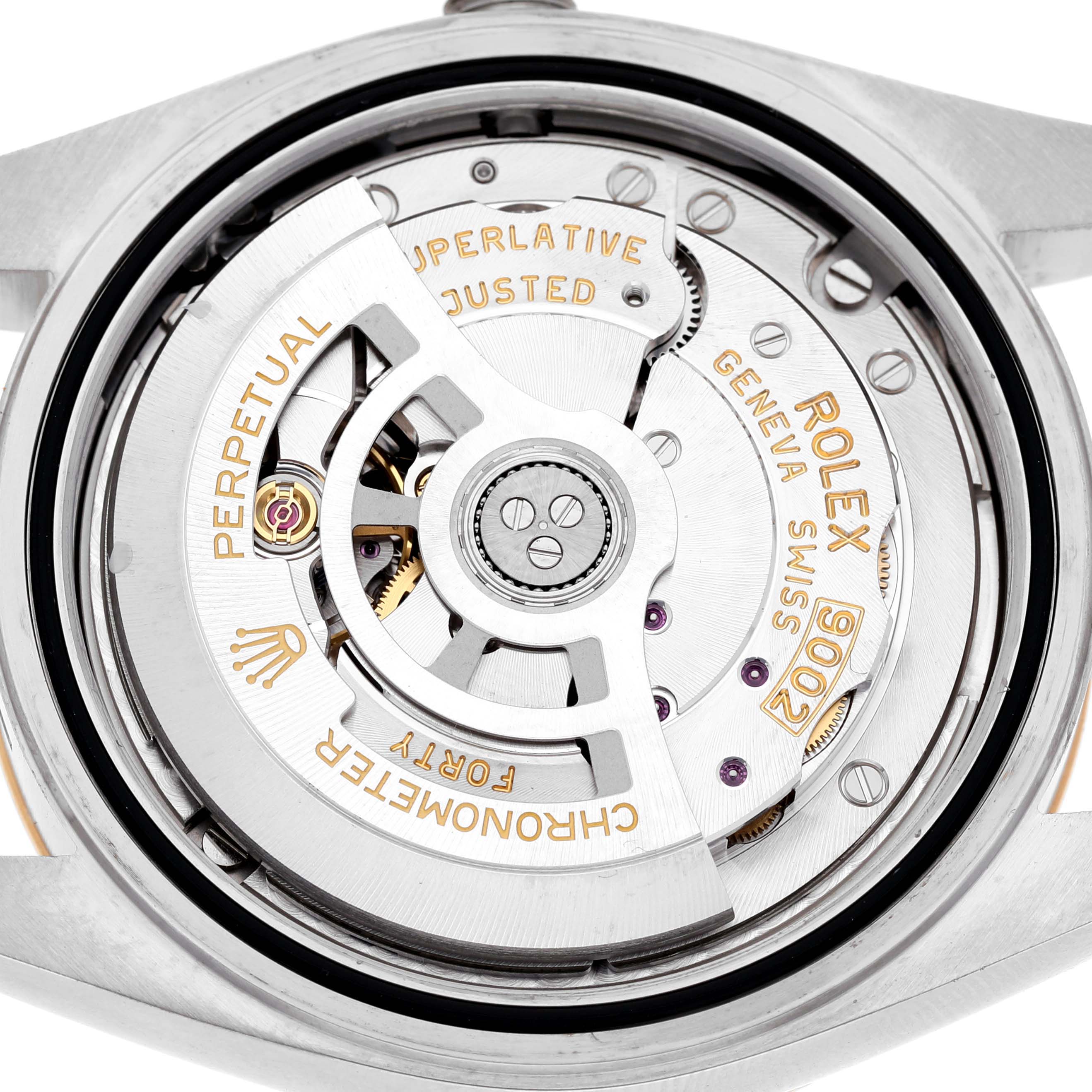The image shows the Rolex Sky-Dweller 336933 Men's Steel and Gold (two tone) Black Dial's movement from the case back angle, highlighting the rotor and intricate components.
