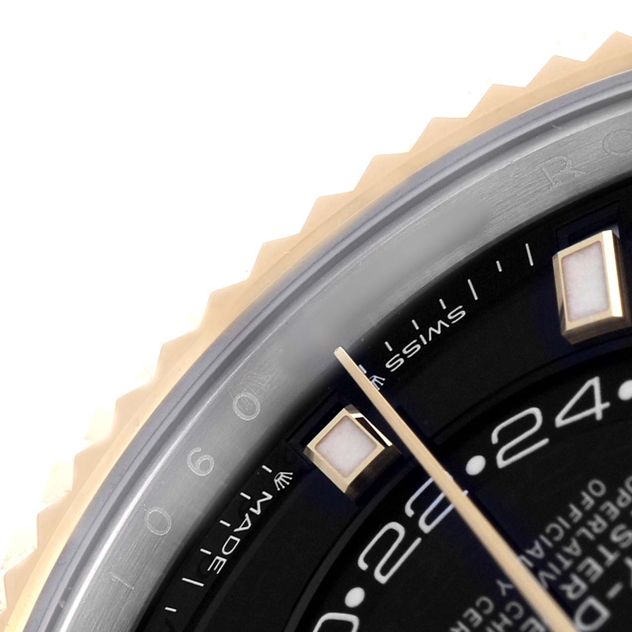 The image shows a close-up angle of the Rolex Sky-Dweller 336933 Men's Steel and Gold (two tone) Black Dial dial highlighting the bezel, hour markers, and minute hand.