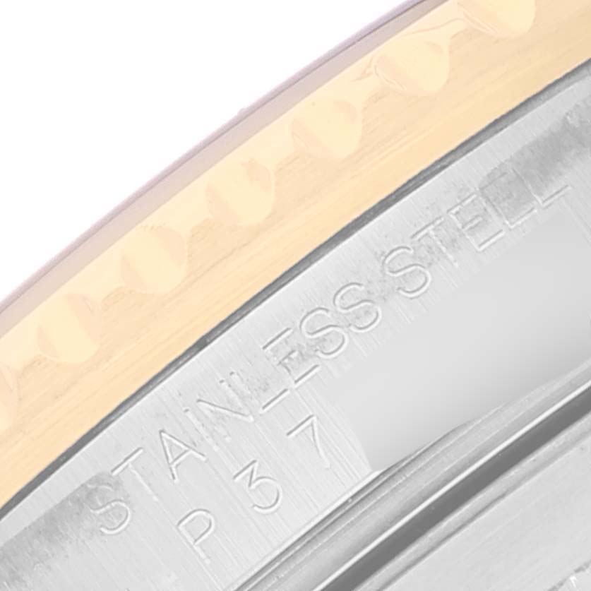 This image shows a close-up of the side of the bezel and case back of a Rolex Submariner 16613 Men's Steel and Gold (two tone) Blue Dial 16613 Men's Steel and Gold (two tone) Blue Dial watch.