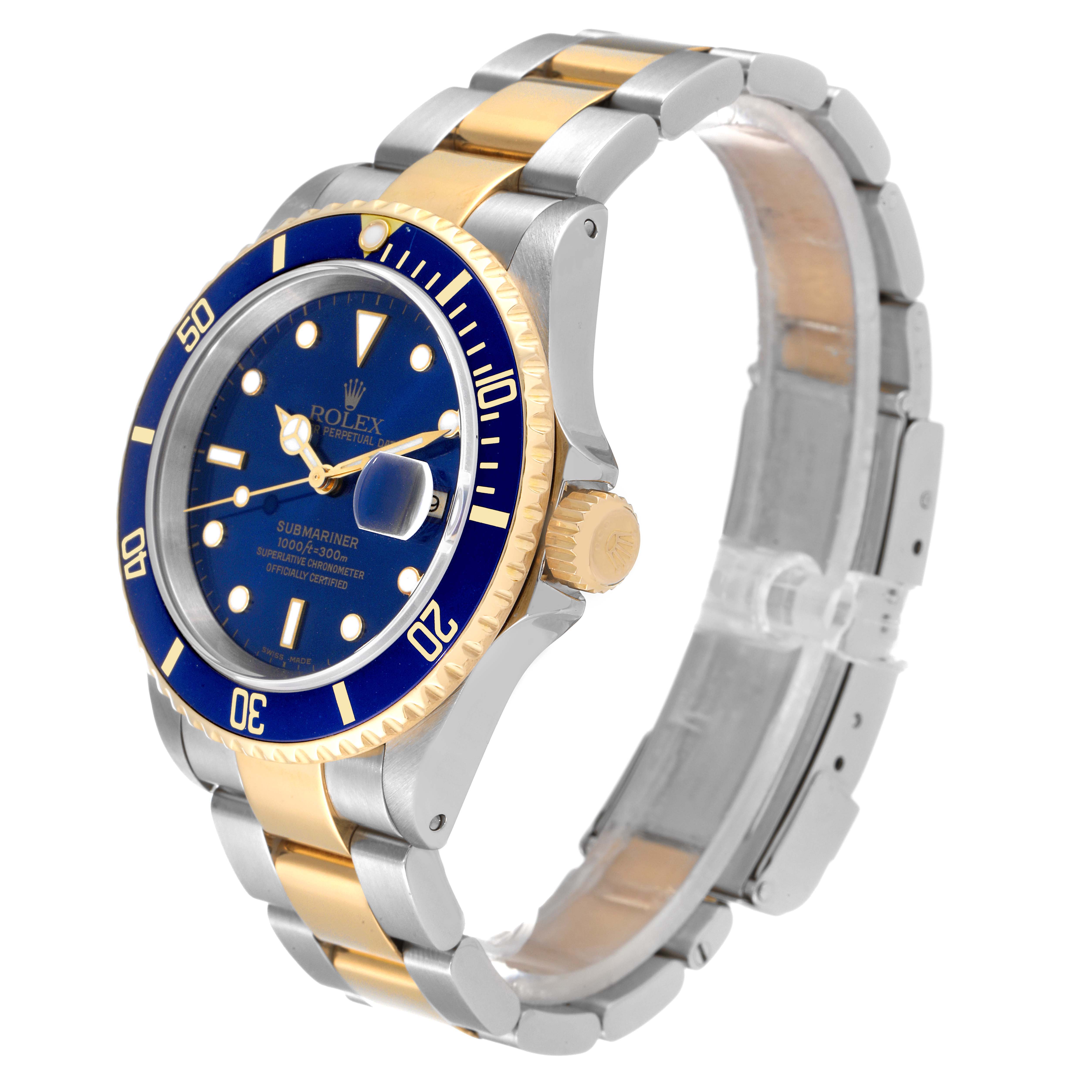 The image shows a Rolex Submariner 16613 Men's Steel and Gold (two tone) Blue Dial 16613 Men's Steel and Gold (two tone) Blue Dial watch at an angle highlighting the blue dial, bezel, gold crown, and two-tone bracelet.