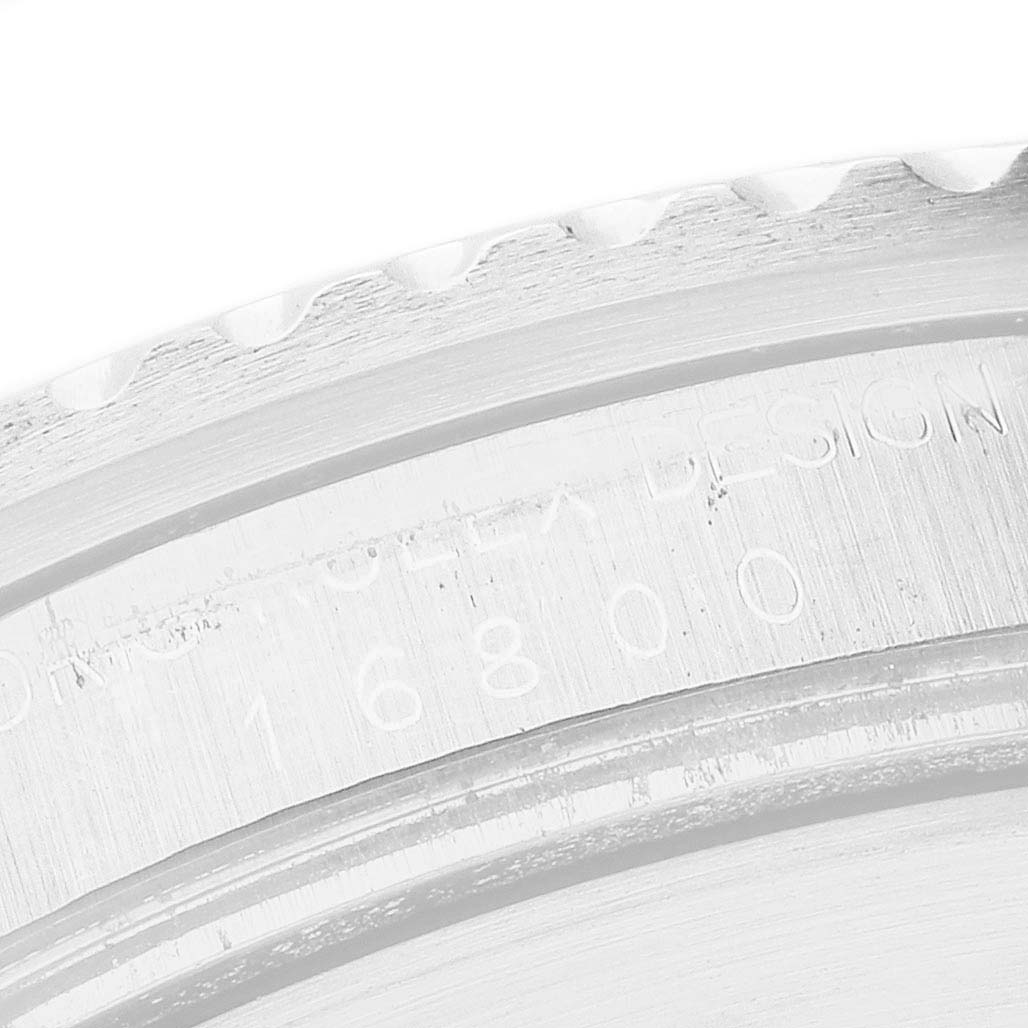 The image shows a close-up of the rehaut engraving on a Rolex Submariner 16800 Men's Stainless Steel Black Dial, highlighting the model number.
