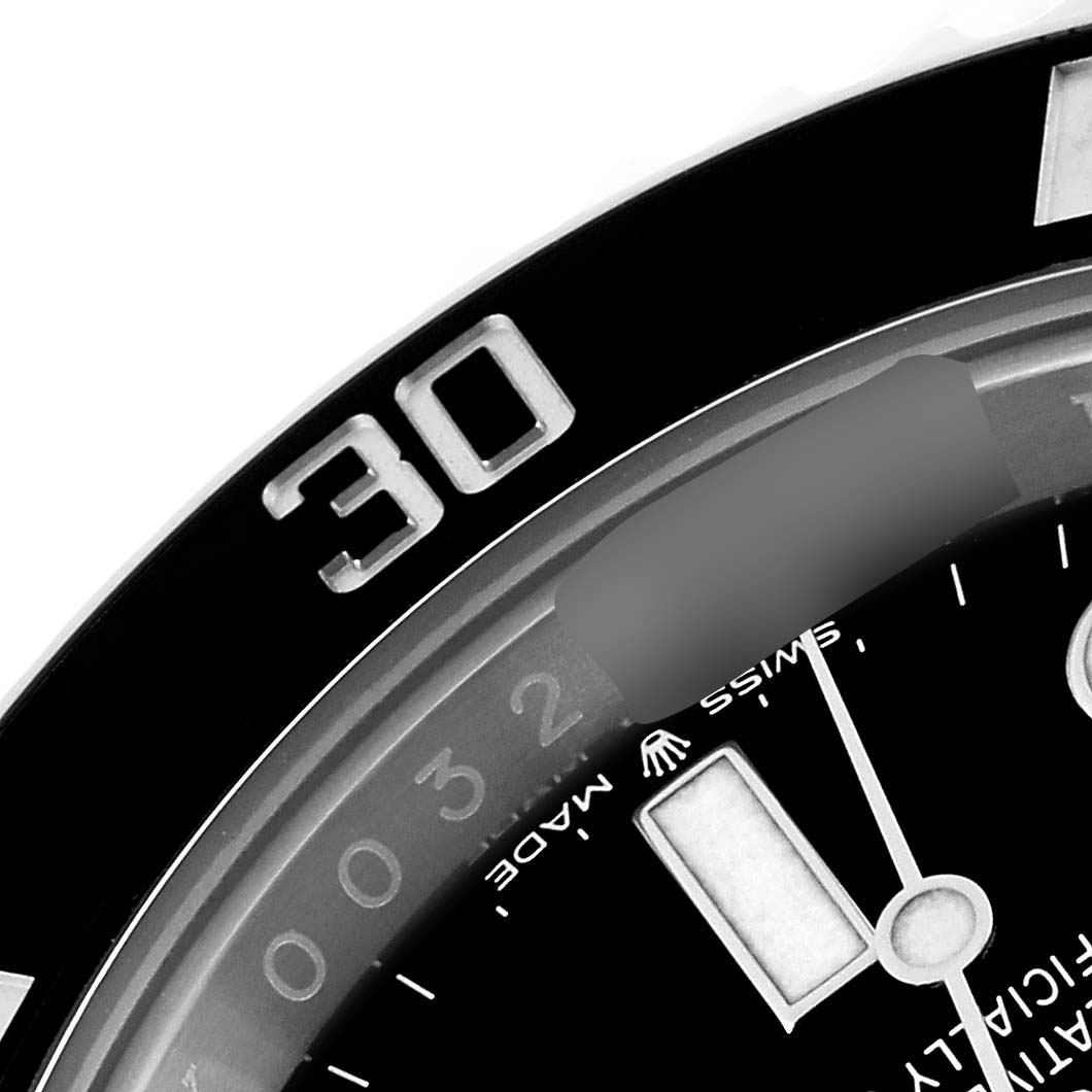 The image shows a close-up of the bezel and part of the dial of a Rolex Submariner 124060 Men
s Stainless Steel Black Dial 124060 Men
s Stainless Steel Black Dial watch.