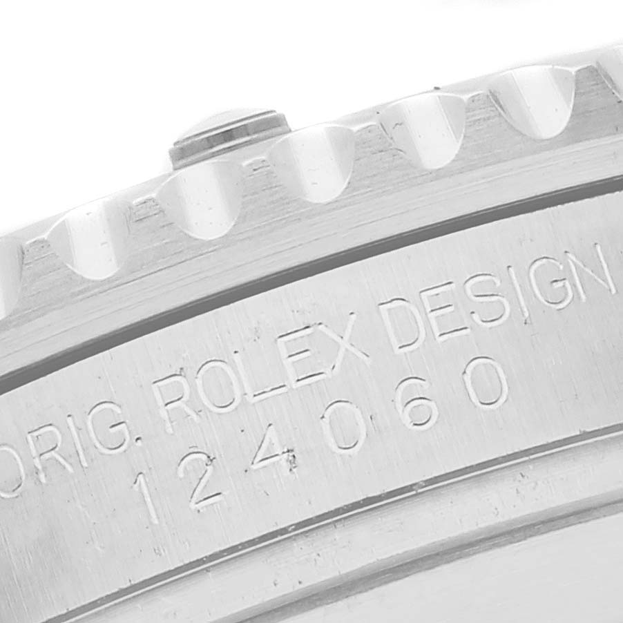The image shows a close-up of the edge and reference number "124060" etched on the side of a Rolex Submariner 124060 Men
s Stainless Steel Black Dial 124060 Men
s Stainless Steel Black Dial watch.