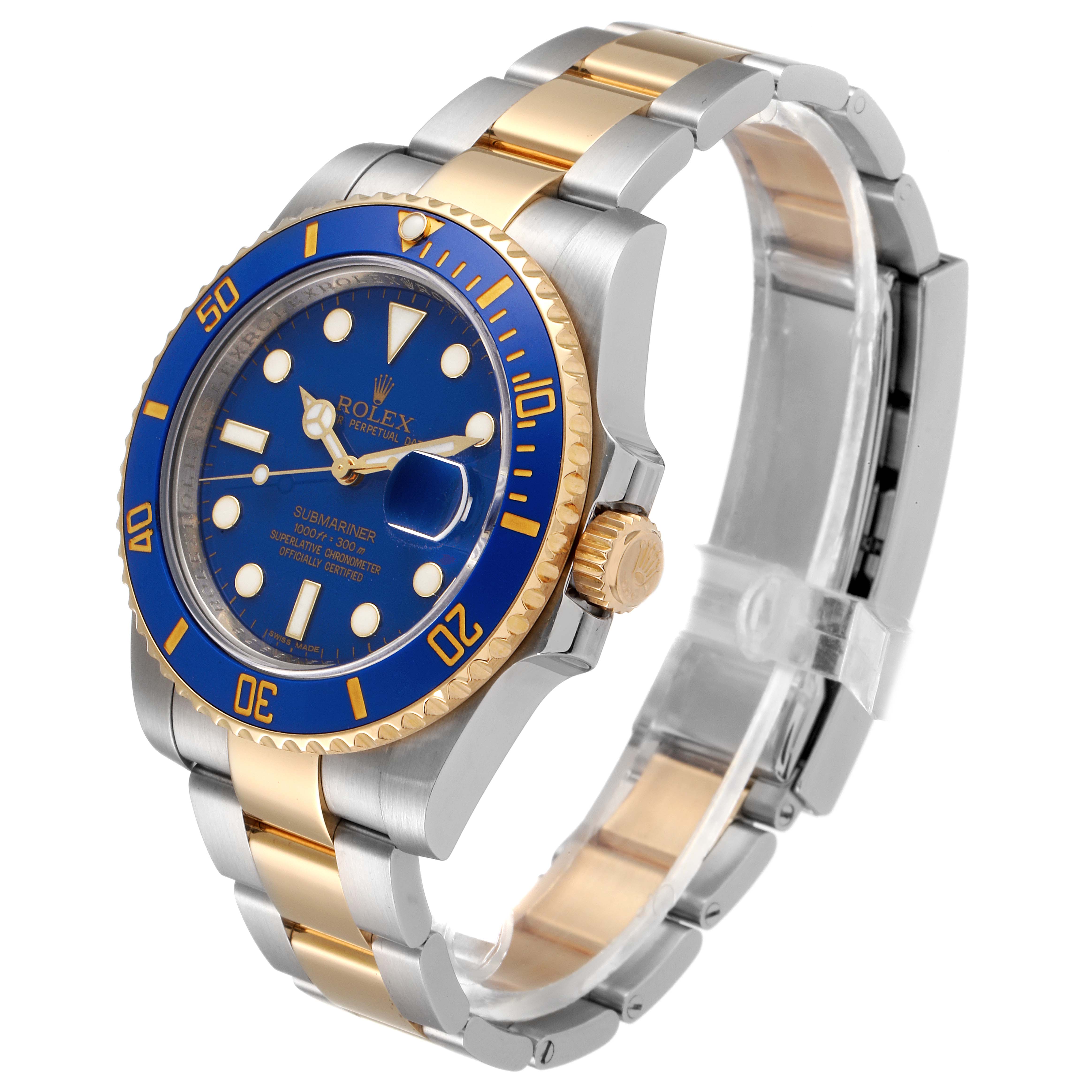 The image shows a Rolex Submariner 116613 Men
s Steel and Gold (two tone) Blue Dial 116613 Men
s Steel and Gold (two tone) Blue Dial watch from an angled side view, highlighting its blue dial and two-tone bracelet.