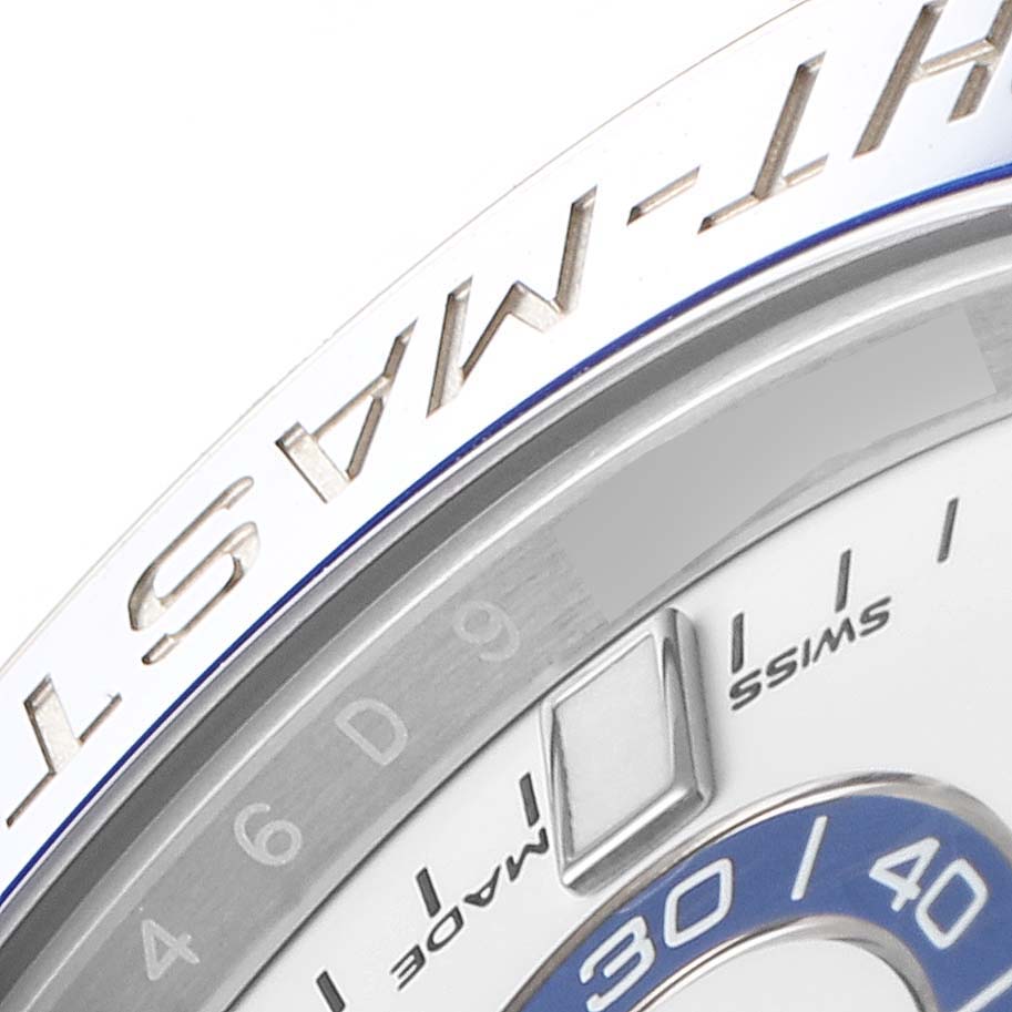The image shows a close-up of the bezel and part of the dial of a Rolex Yacht-Master 116680 Men
s Stainless Steel White Dial 116680 Men
s Stainless Steel White Dial watch.