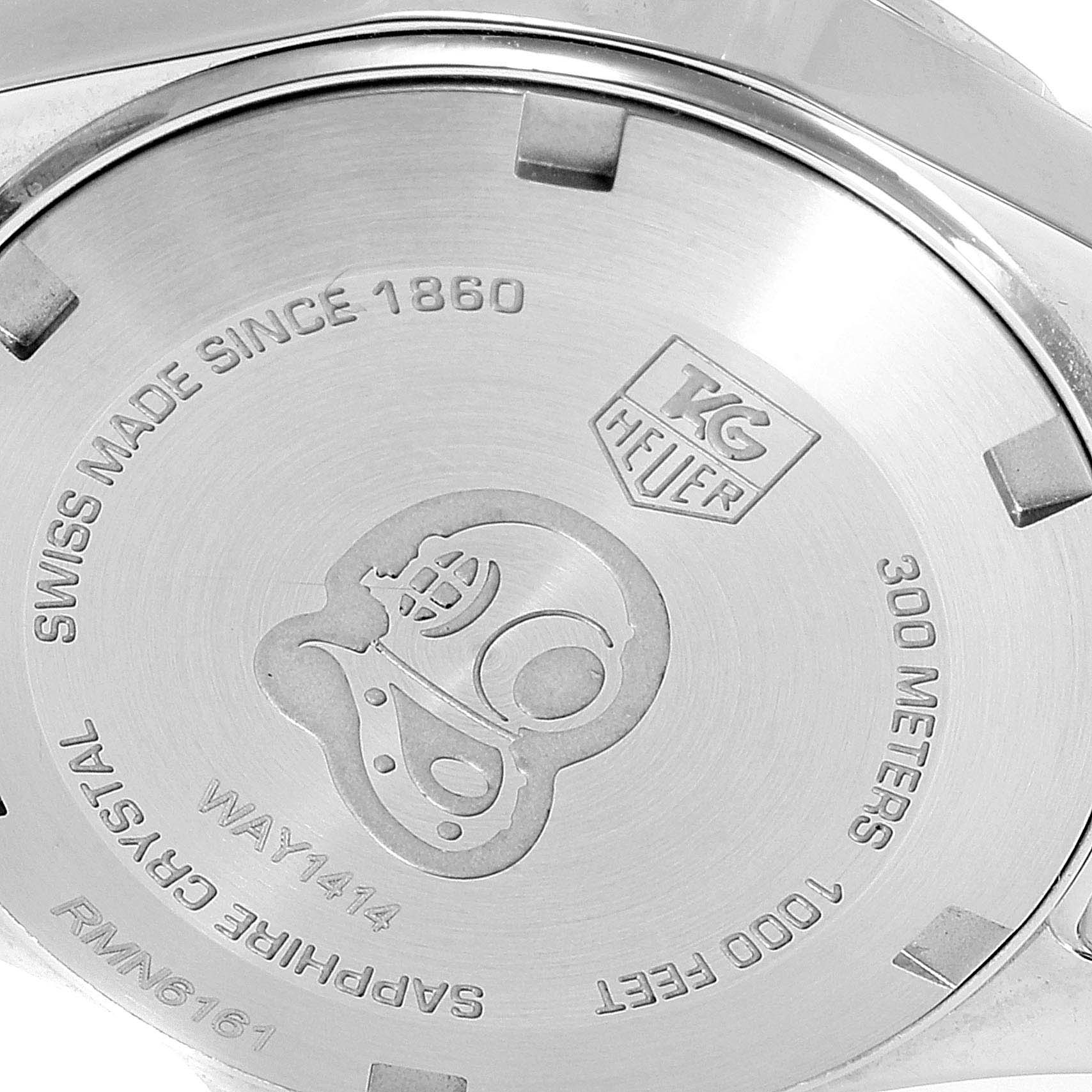 The image shows the back casing of the Tag Heuer Aquaracer WAY1414.BA0920 Women's Stainless Steel Mother of Pearl Dial WAY1414.BA0920 Women's Stainless Steel Mother of Pearl Dial watch, highlighting the brand logo and model information.