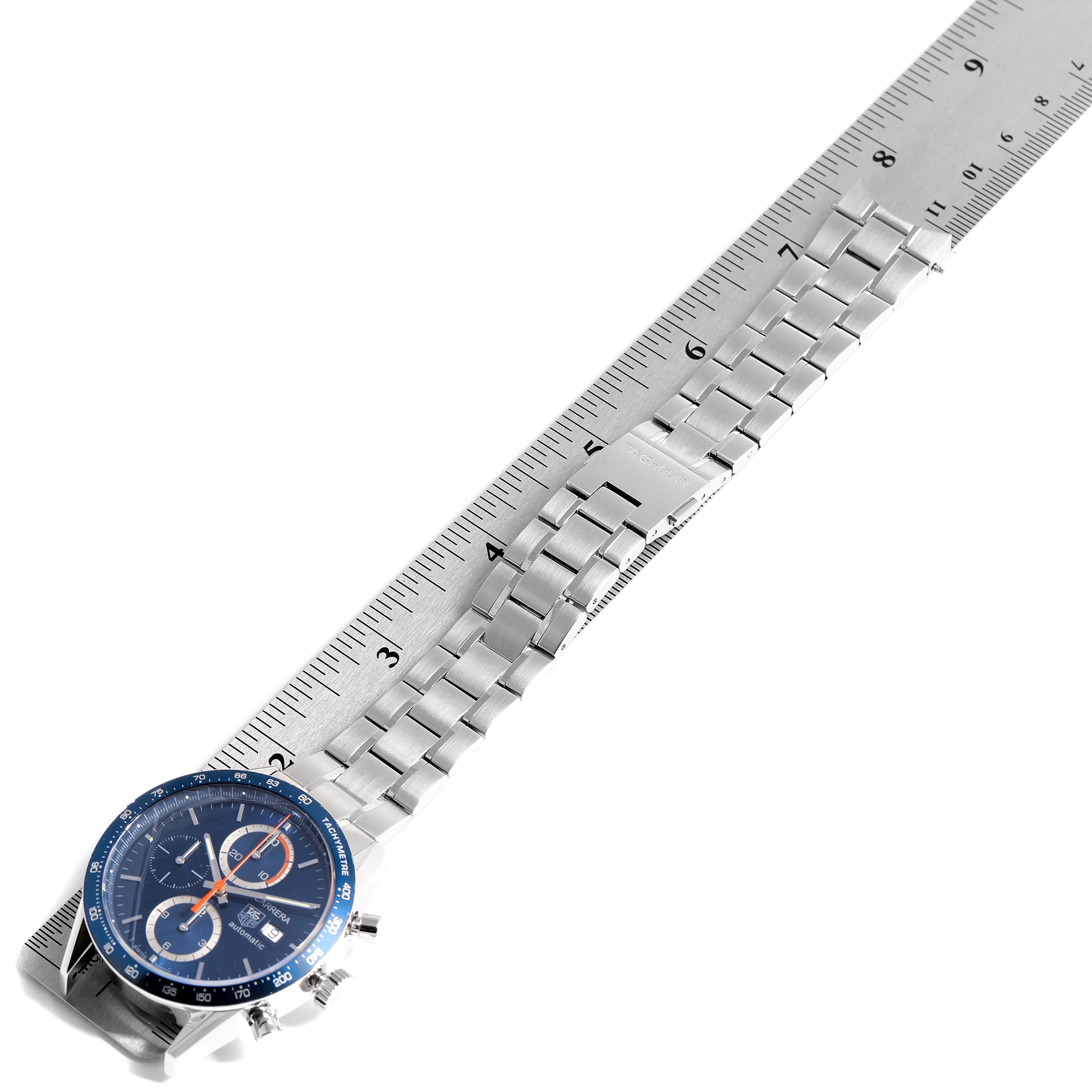 The image shows a Tag Heuer Carrera CV2A1V.BA0738 Men
s Stainless Steel Blue Dial CV2A1V.BA0738 Men
s Stainless Steel Blue Dial watch laying flat with its metal bracelet measured against a ruler.