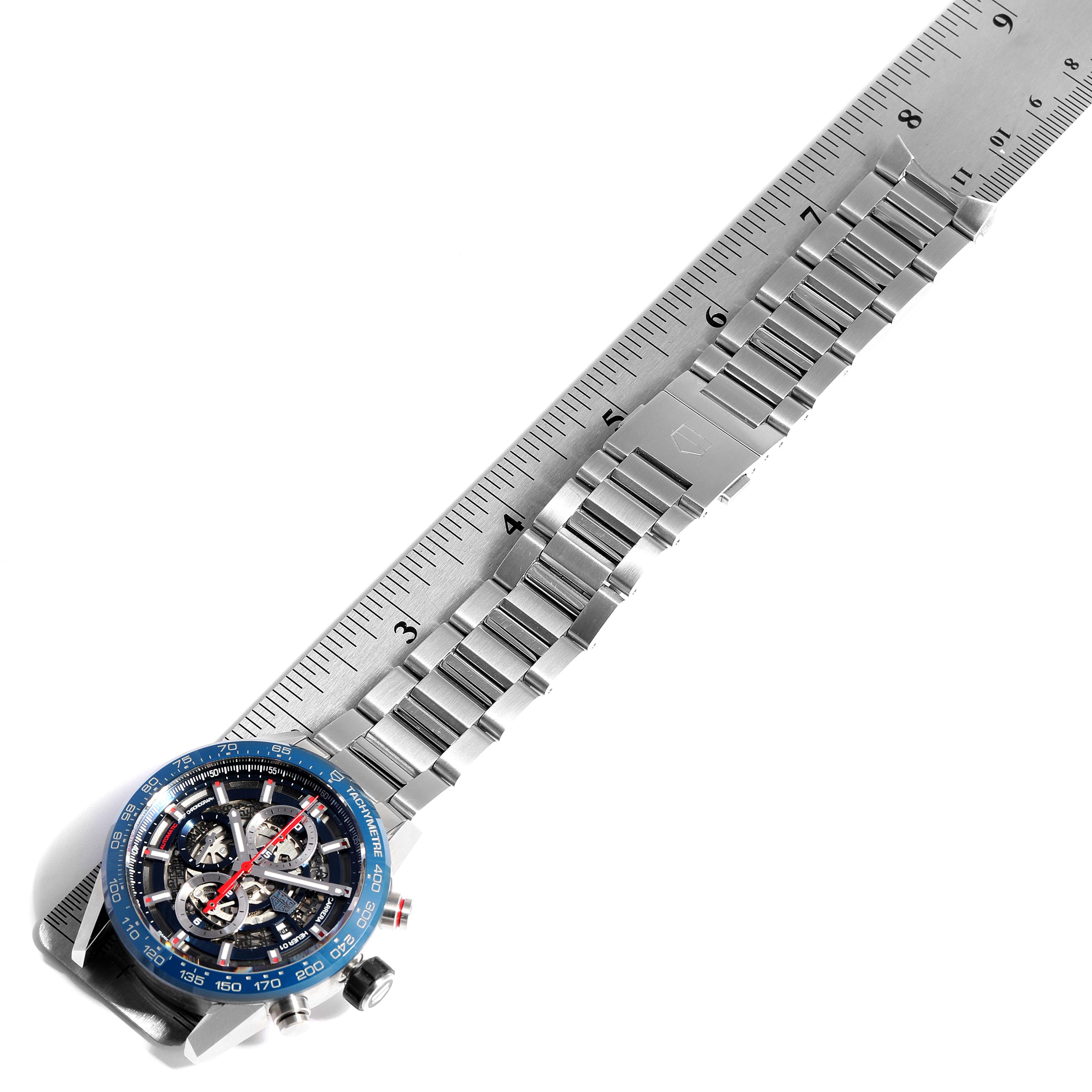 The image shows a top-down view of a Tag Heuer Carrera CAR201T.BA0766 Men's Stainless Steel Blue Dial CAR201T.BA0766 Men's Stainless Steel Blue Dial watch with its bracelet against a ruler.