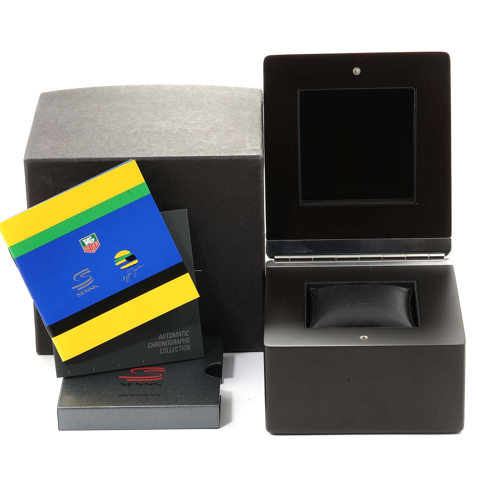 The image shows packaging, a display box, and booklets for a Limited Edition Tag Heuer Senna model.