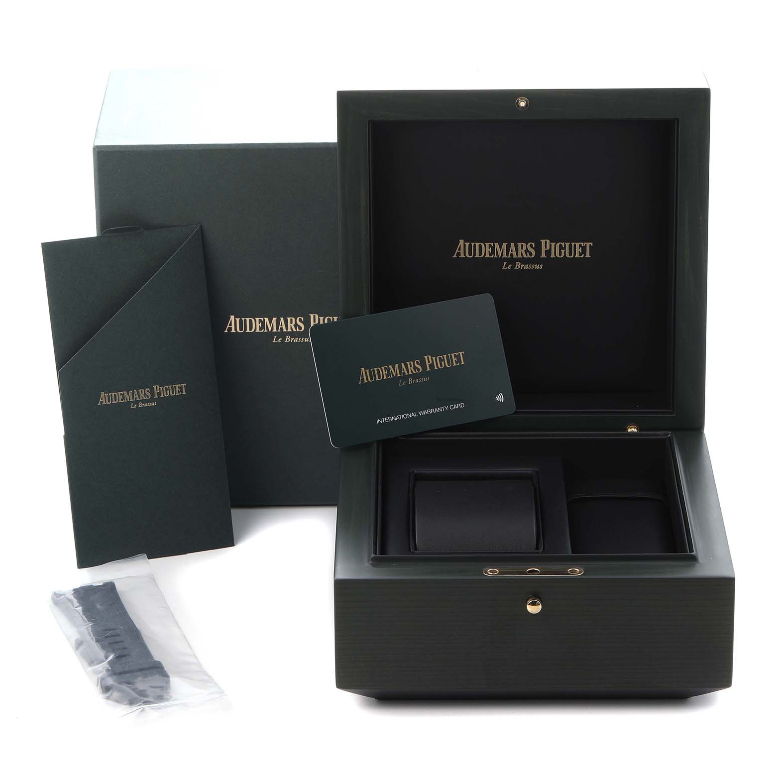 The image shows the packaging and accessories for the Audemars Piguet Royal Oak Offshore 15720ST Men
s Stainless Steel Green Dial 15720ST Men
s Stainless Steel Green Dial, including a box, warranty card, and spare strap.