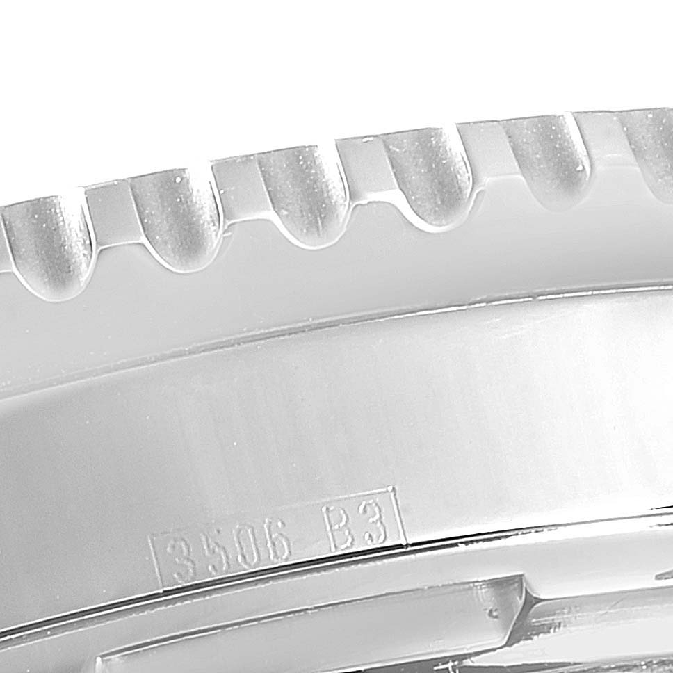 This is a close-up shot of the bezel and part of the case of a Breitling Navitimer A23322 Men
s Stainless Steel Black Dial A23322 Men
s Stainless Steel Black Dial watch, showcasing its detailed engravings and ridges.