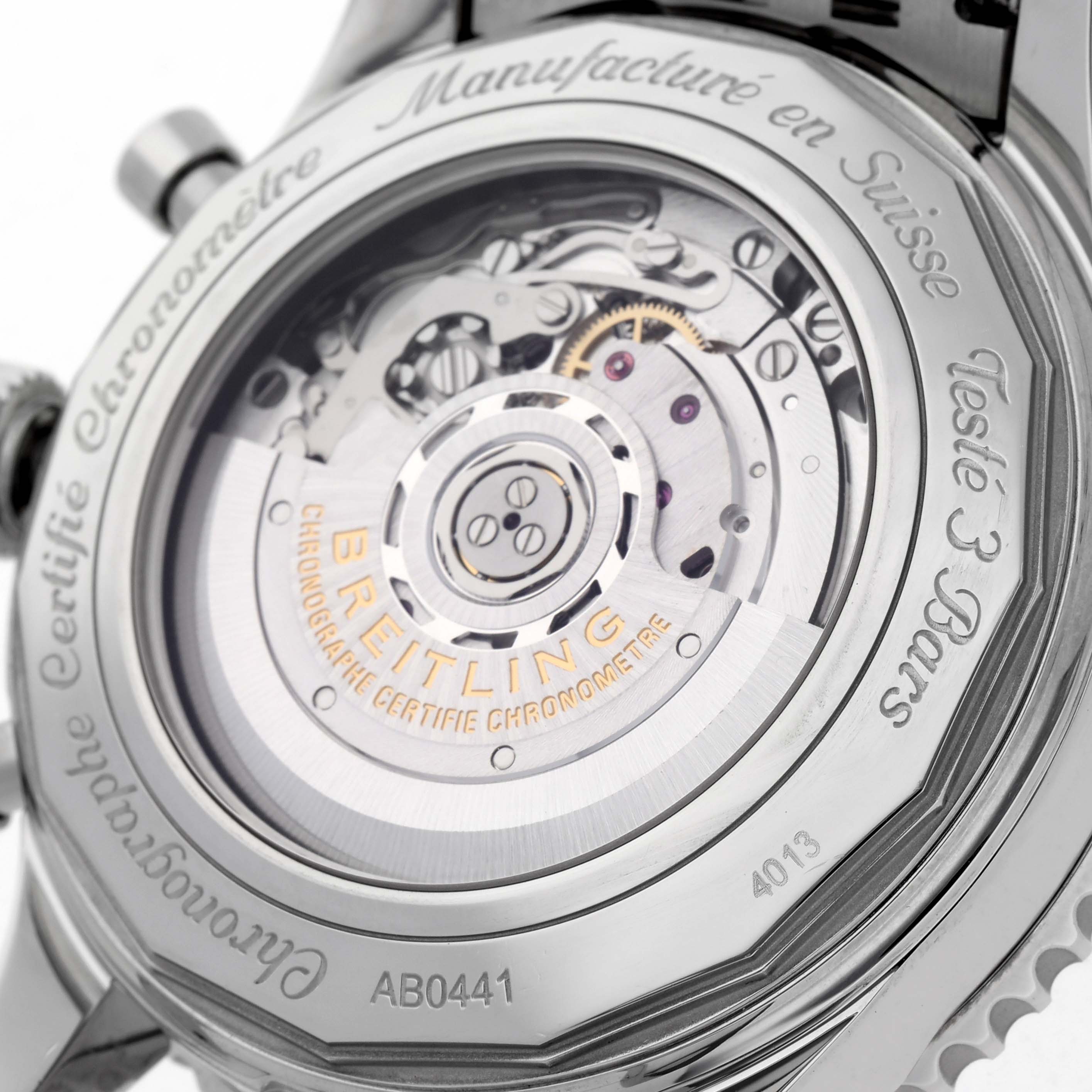 The image shows the back view of the Breitling Navitimer AB0441 Men
s Stainless Steel Black Dial AB0441 Men
s Stainless Steel Black Dial, highlighting its mechanical movement and engravings.