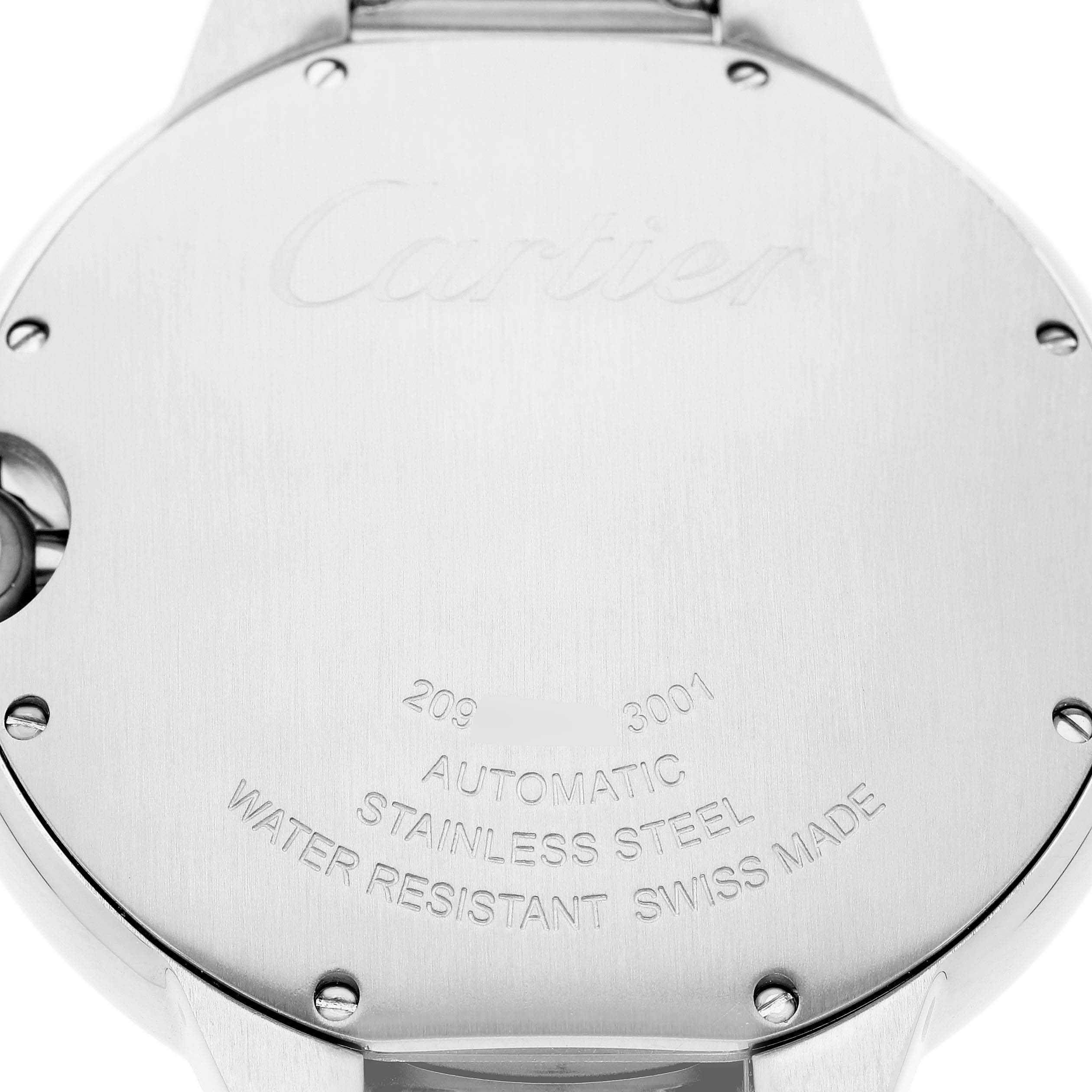 The image shows the back case of a Cartier Ballon Bleu W69012Z4 Men's Stainless Steel Silver Dial watch, highlighting the engraving and screw details.