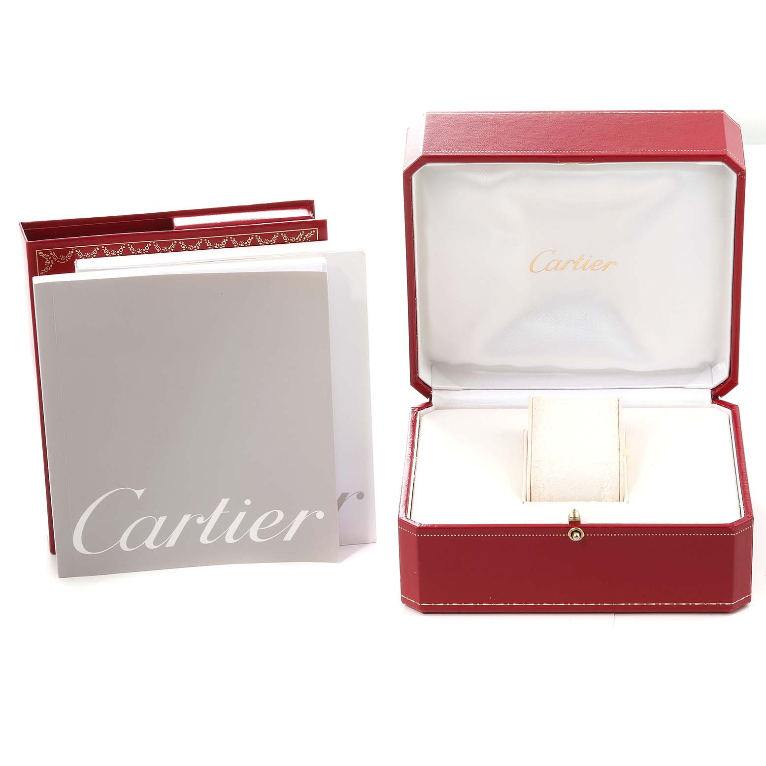 The image shows an open red Cartier box and accompanying booklets for a Calibre de Cartier watch.