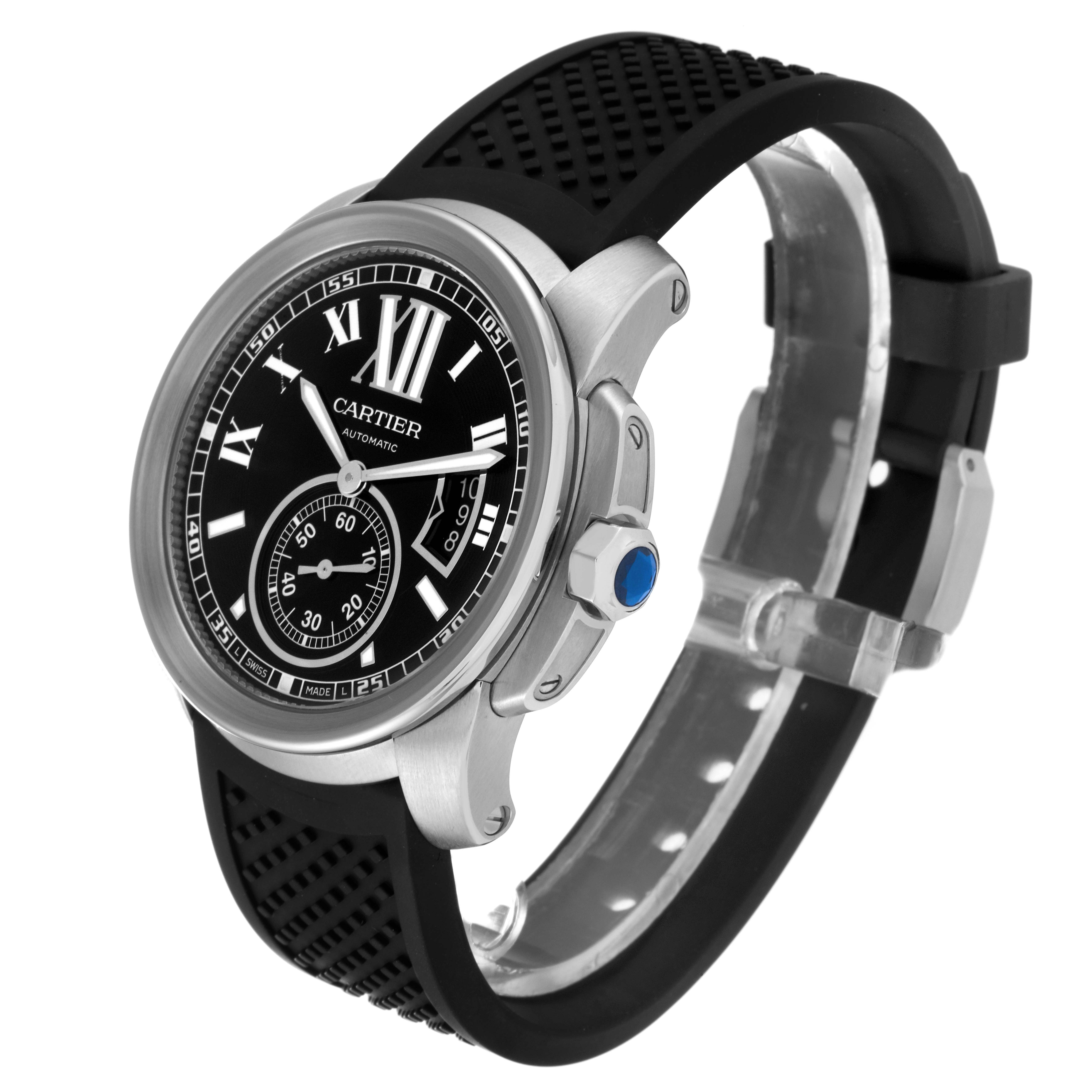 The Calibre de Cartier watch is shown at a three-quarter angle, displaying the face, bezel, crown, and black rubber strap.