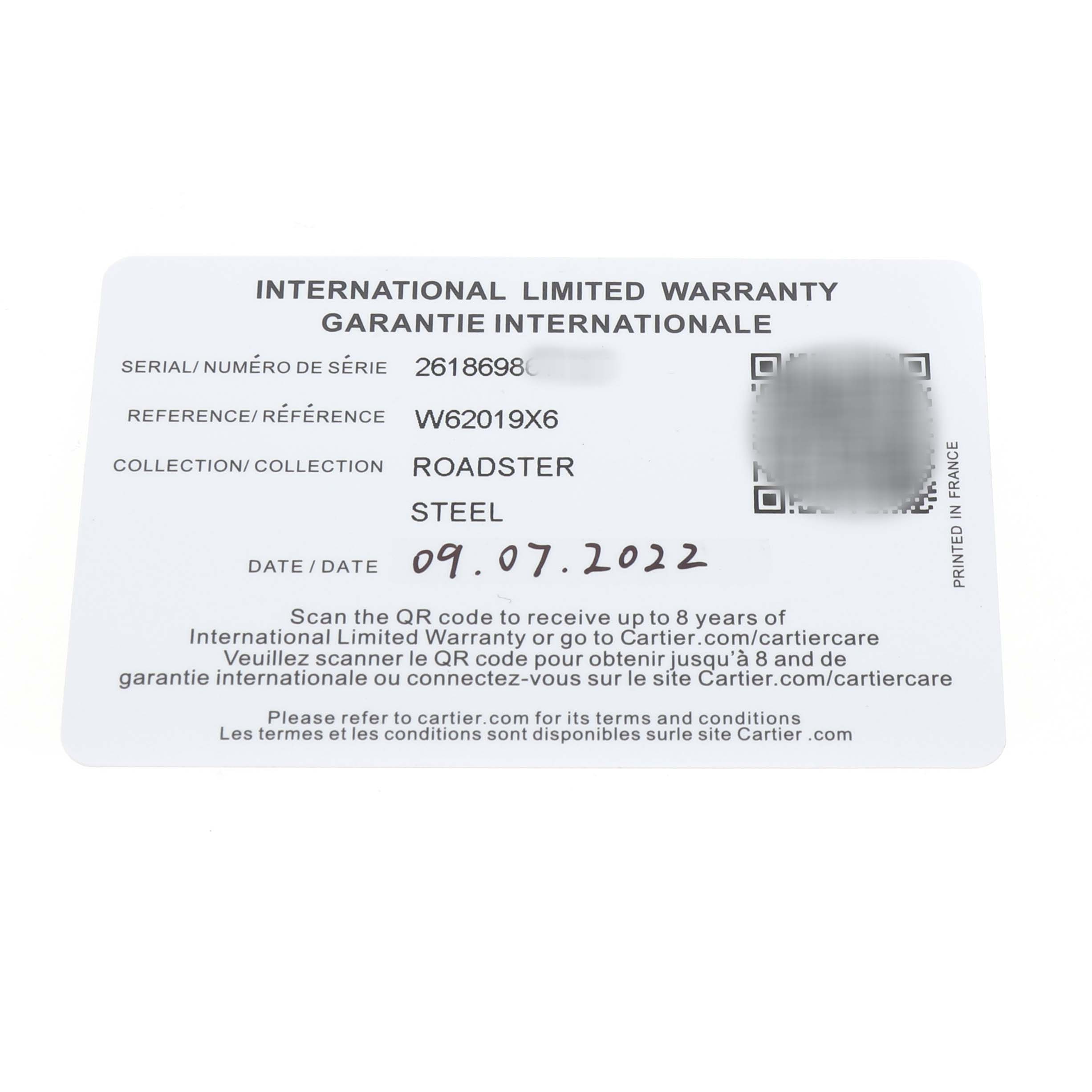 The image shows an International Limited Warranty card for a Cartier Roadster W62019X6 Men's Stainless Steel Silver Dial watch, displaying serial, reference numbers, and date.