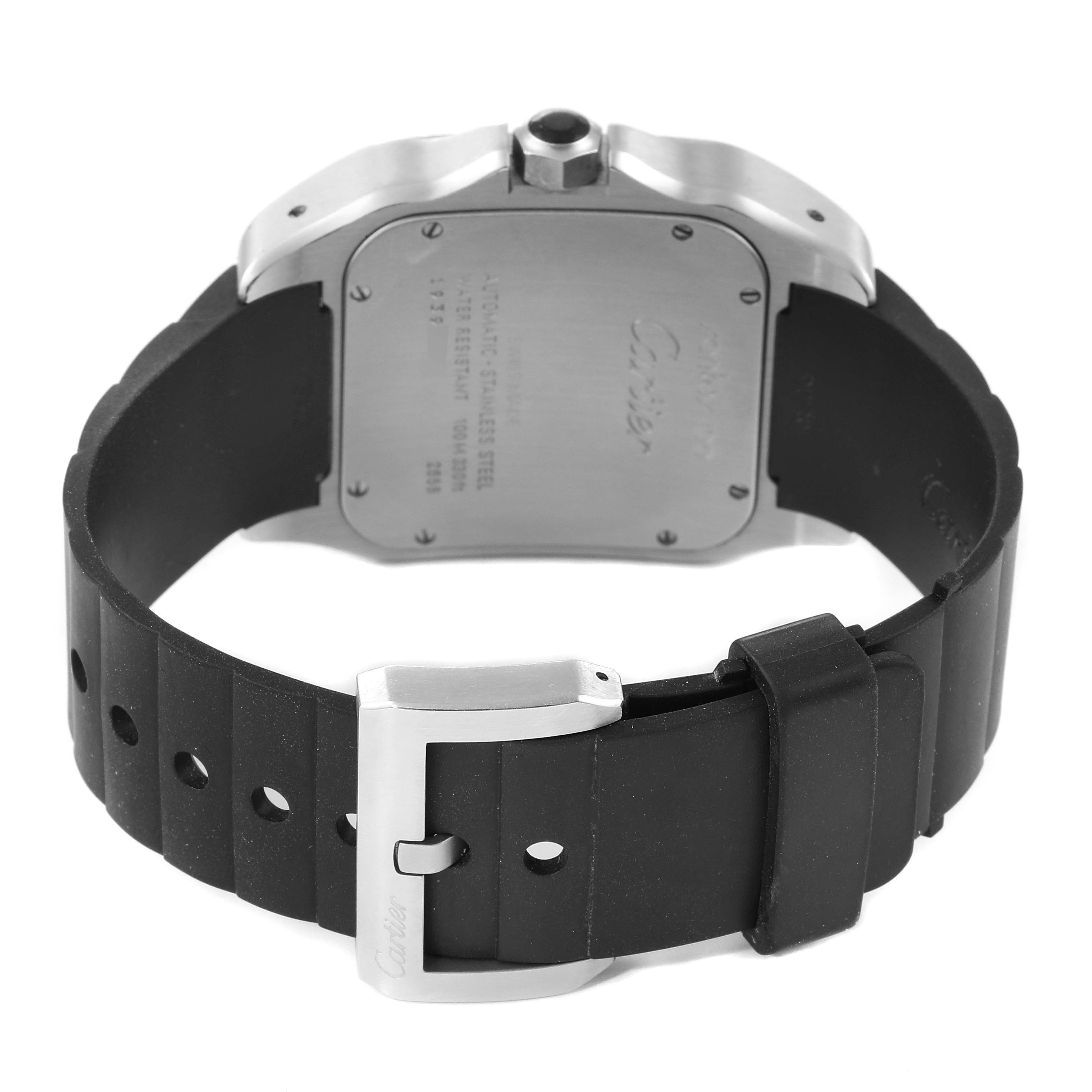 The image shows the back of a Santos model by Cartier, focusing on the case back and the rubber strap with a buckle.