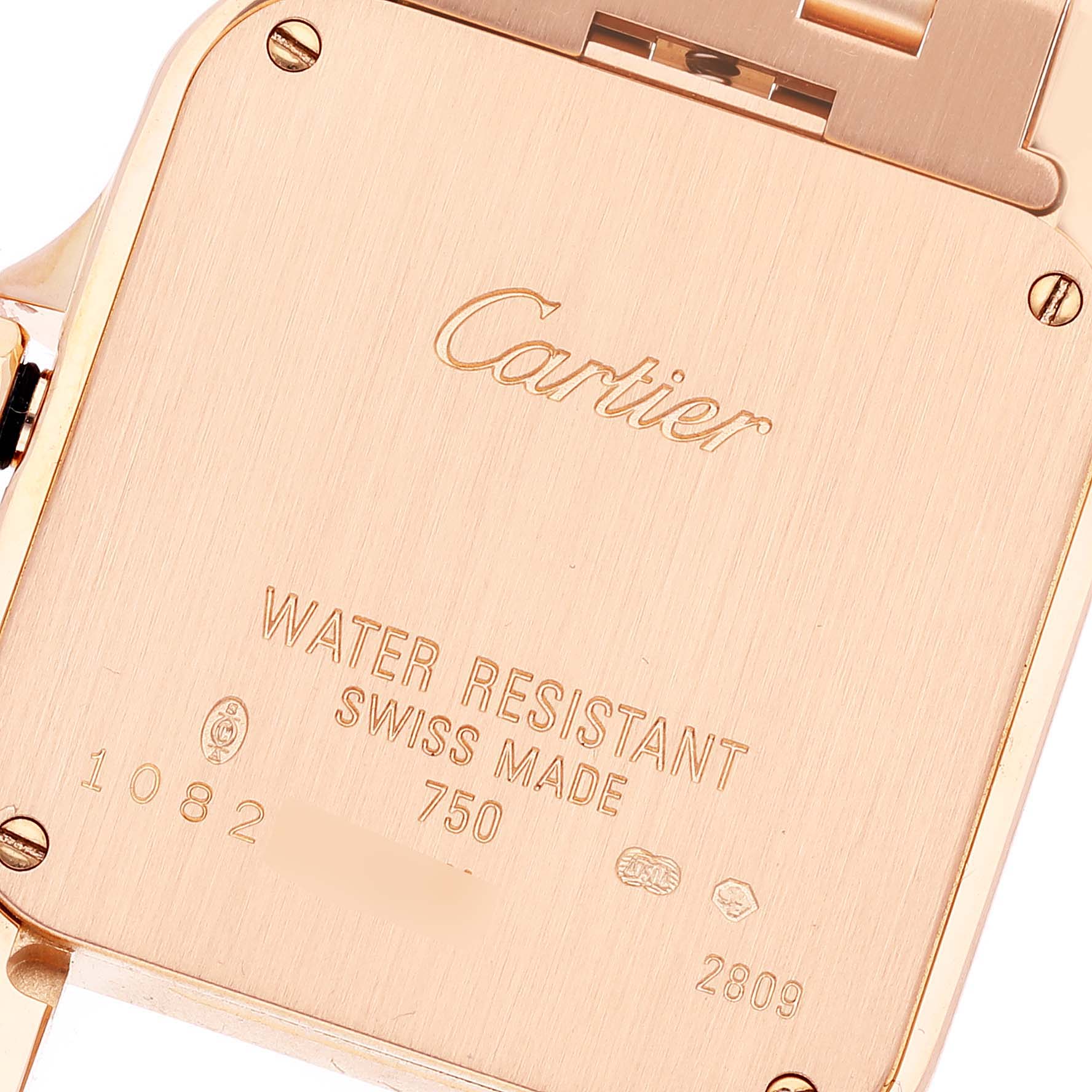This image shows the back case of a Cartier Santos Demoiselle WF9007Z8 Women
s Rose Gold Silver Dial WF9007Z8 Women
s Rose Gold Silver Dial watch, highlighting the brand name and water resistance details.