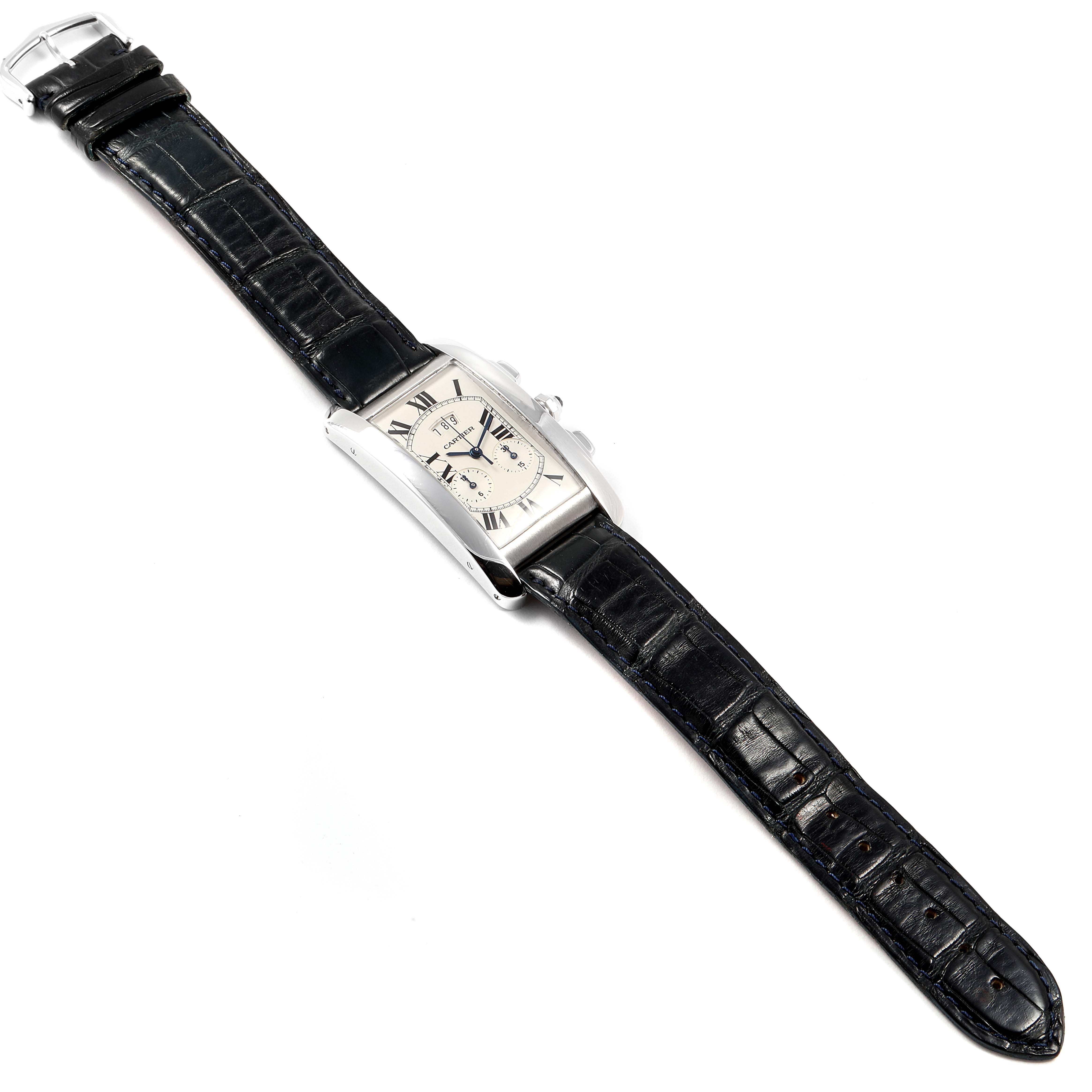 The Cartier Tank Americaine 2569 Men
s White Gold Silver Dial 2569 Men
s White Gold Silver Dial watch is shown from a top-down angle, displaying the face, strap, and buckle.