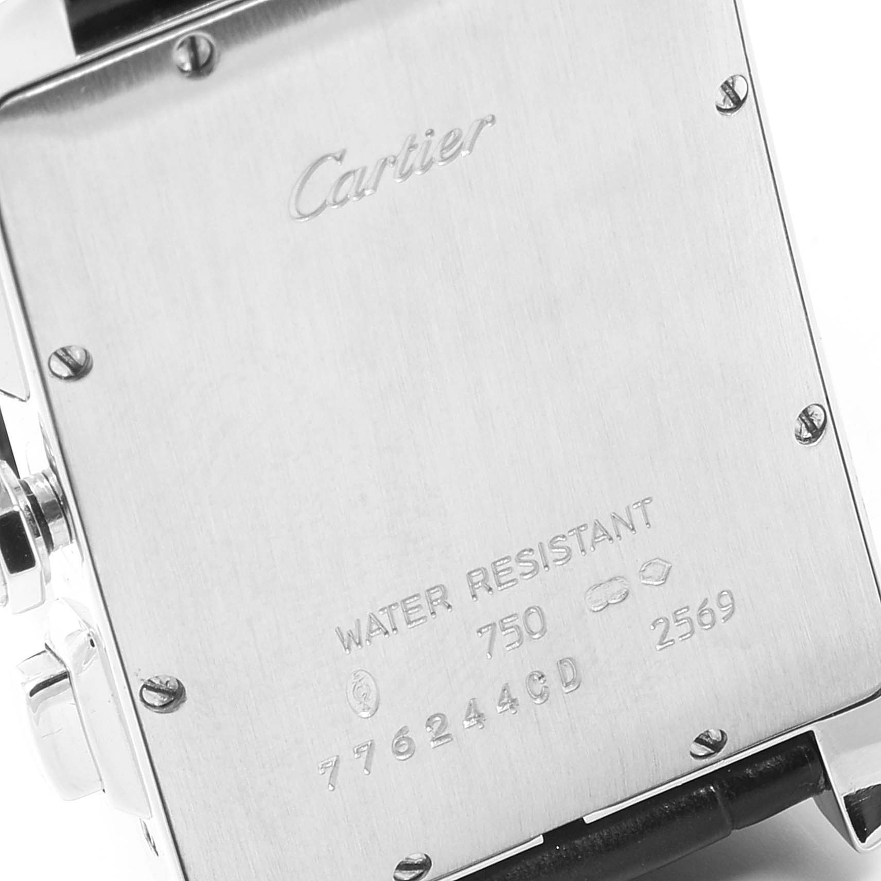 This image shows the back case of the Cartier Tank Americaine 2569 Men
s White Gold Silver Dial 2569 Men
s White Gold Silver Dial watch, displaying engravings and screws.