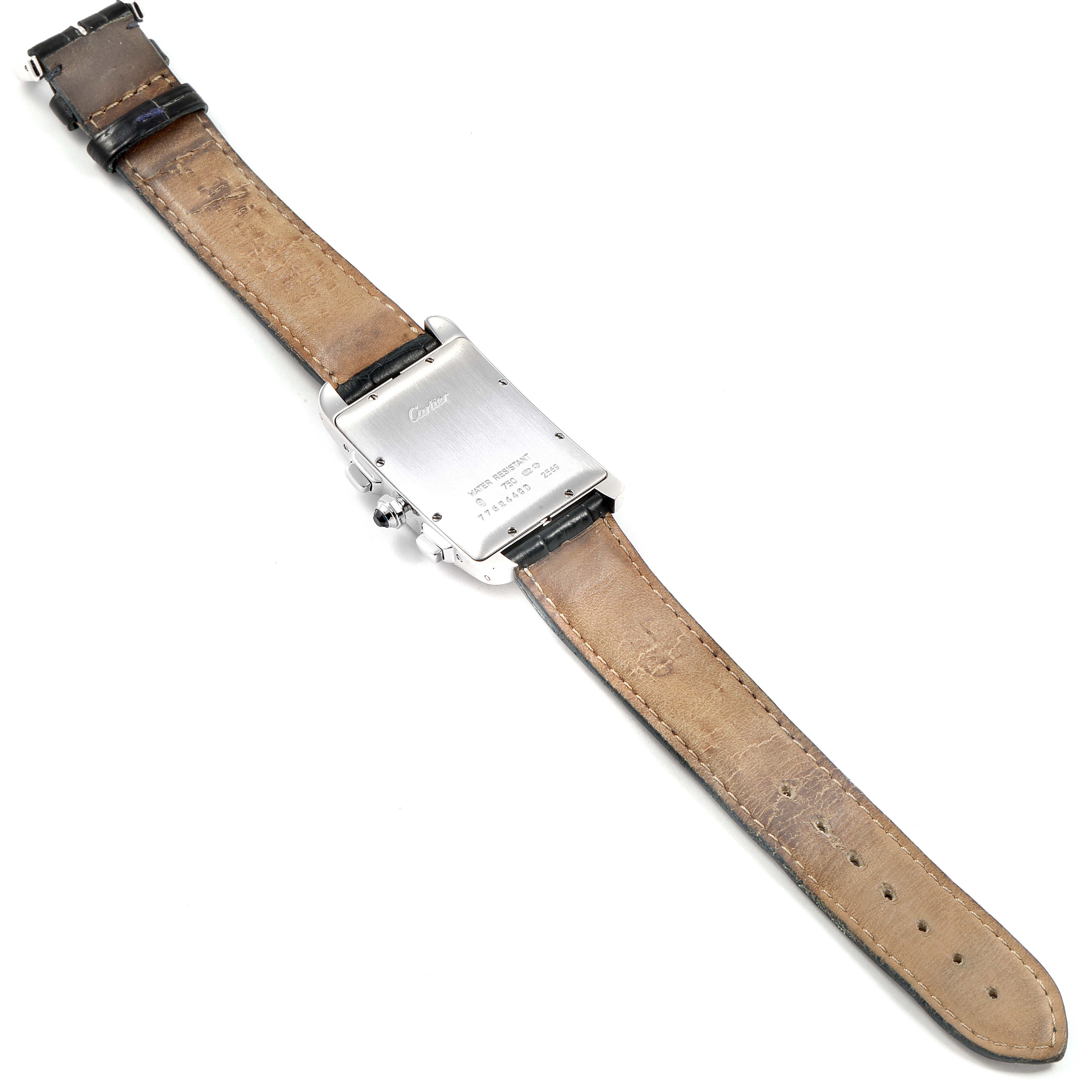 The image shows the back view of a Cartier Tank Americaine 2569 Men
s White Gold Silver Dial 2569 Men
s White Gold Silver Dial watch, displaying the back casing and leather straps.