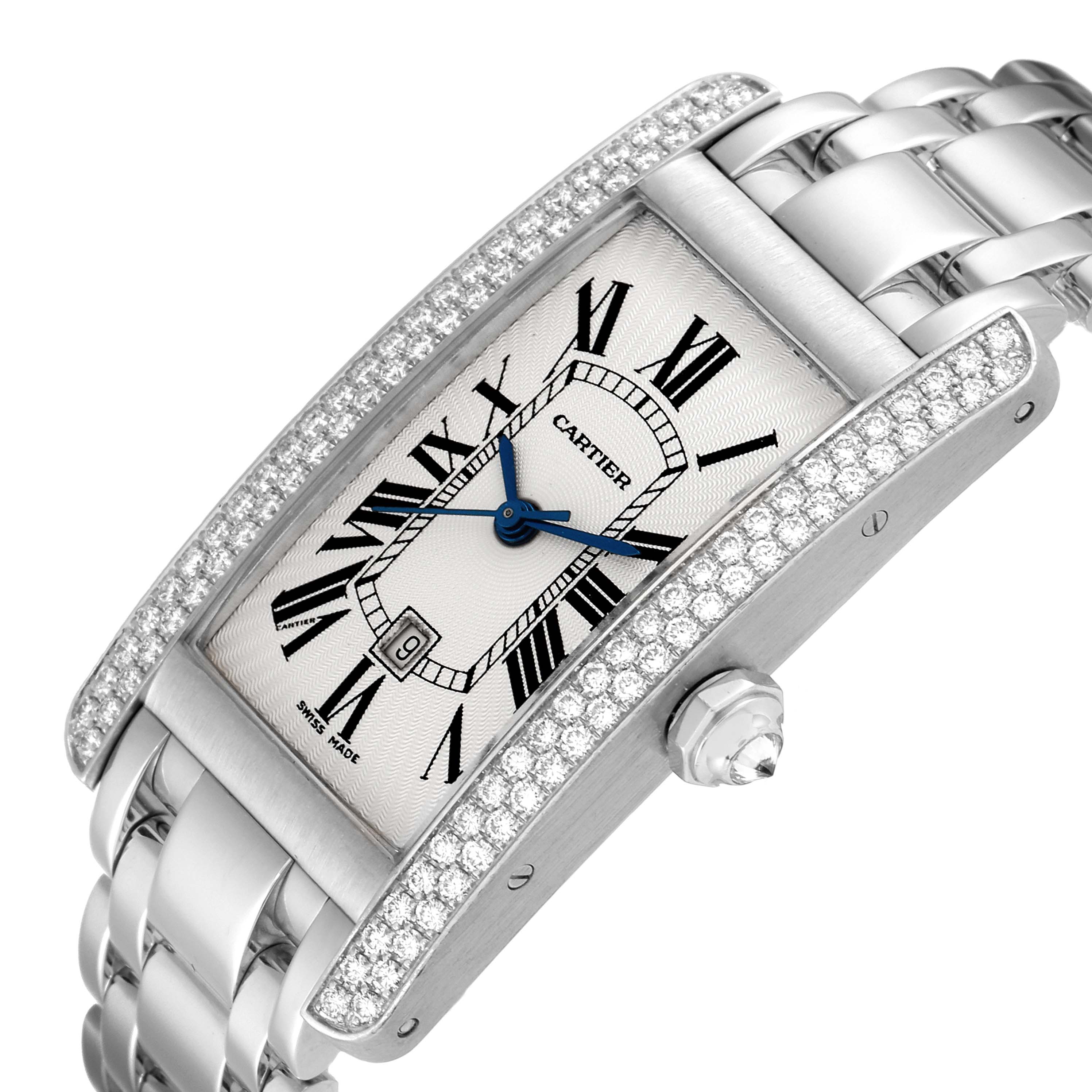 This image shows a close-up angled view of the Cartier Tank Américaine watch, highlighting its face, bezel, crown, and portions of the bracelet.