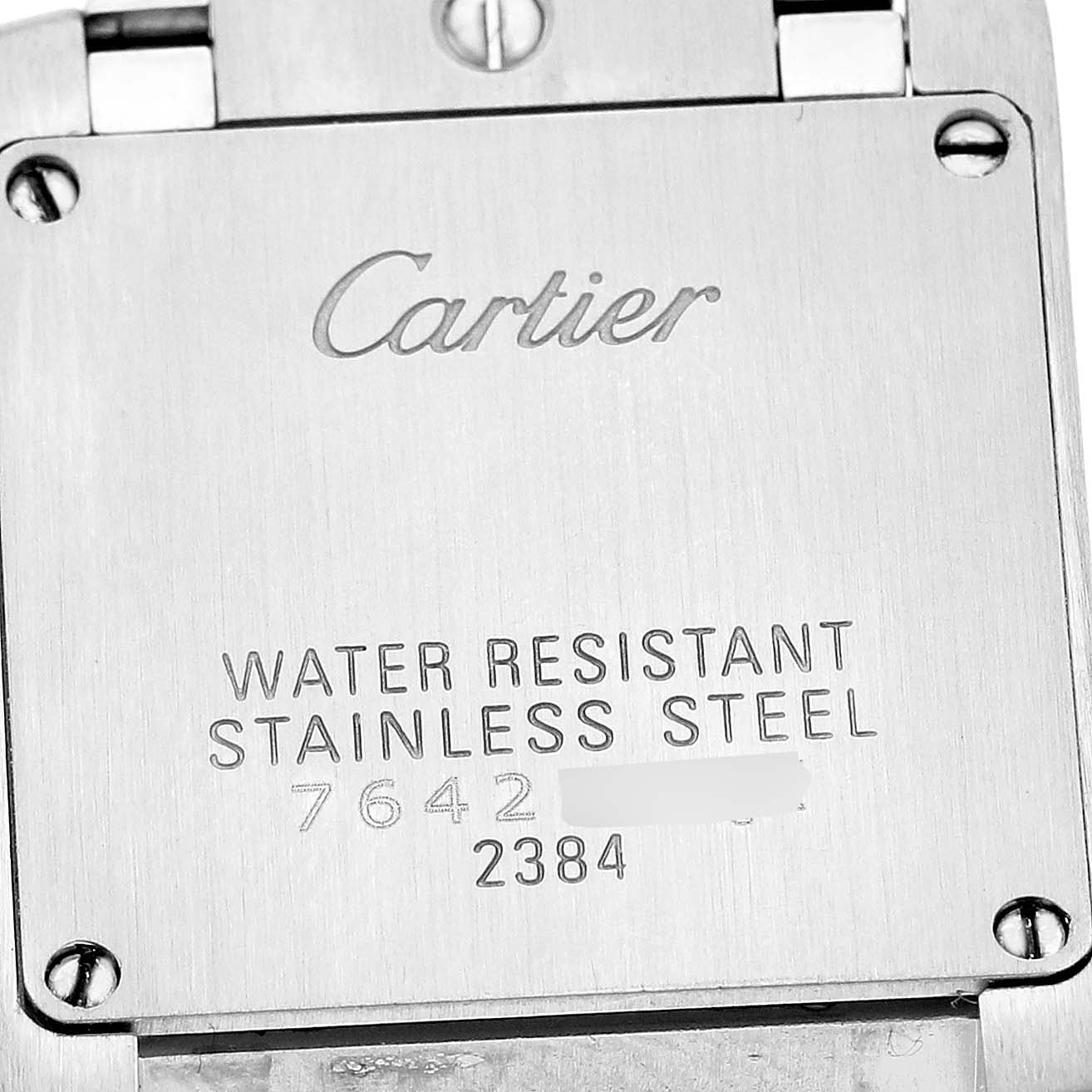 The image shows the back case of the Cartier Tank Française watch, highlighting its stainless steel and model details.