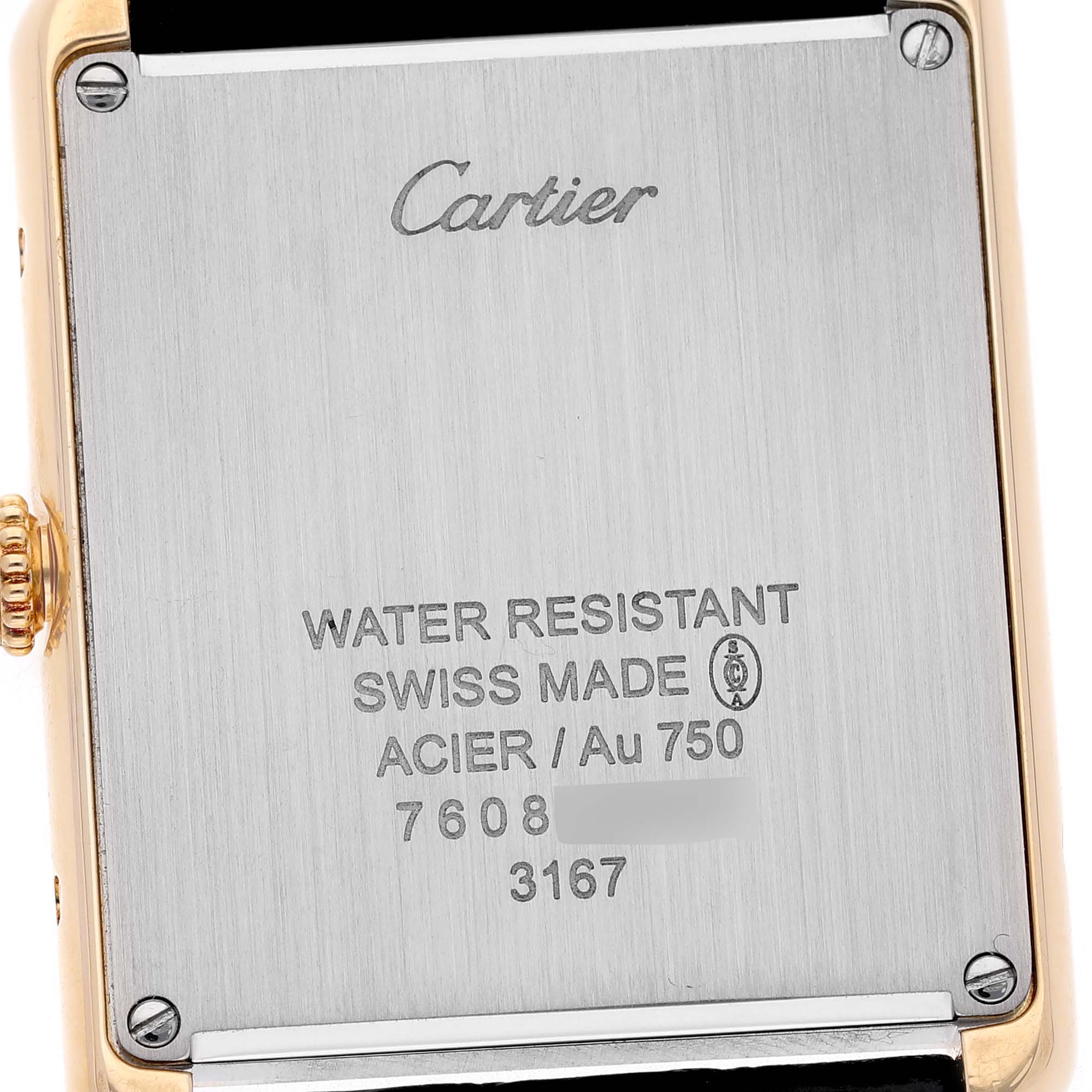 The image shows the back case of a Cartier Tank Solo W5200004 Men's Steel and Gold (two tone) Silver Dial watch, highlighting the brand, model details, and material specifications.