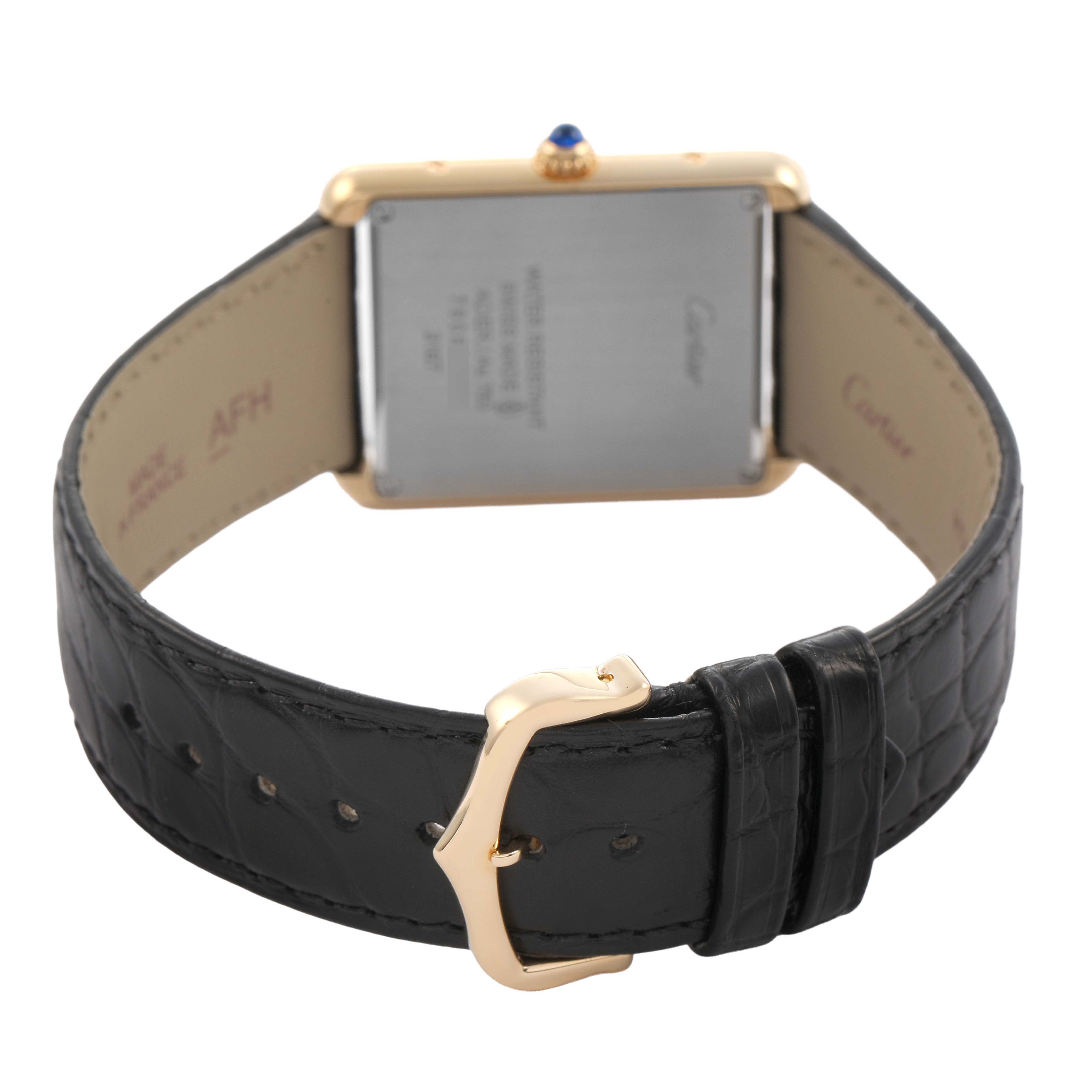 The Cartier Tank Solo W5200004 Men's Steel and Gold (two tone) Silver Dial watch is shown from the back, highlighting its leather strap and gold buckle.
