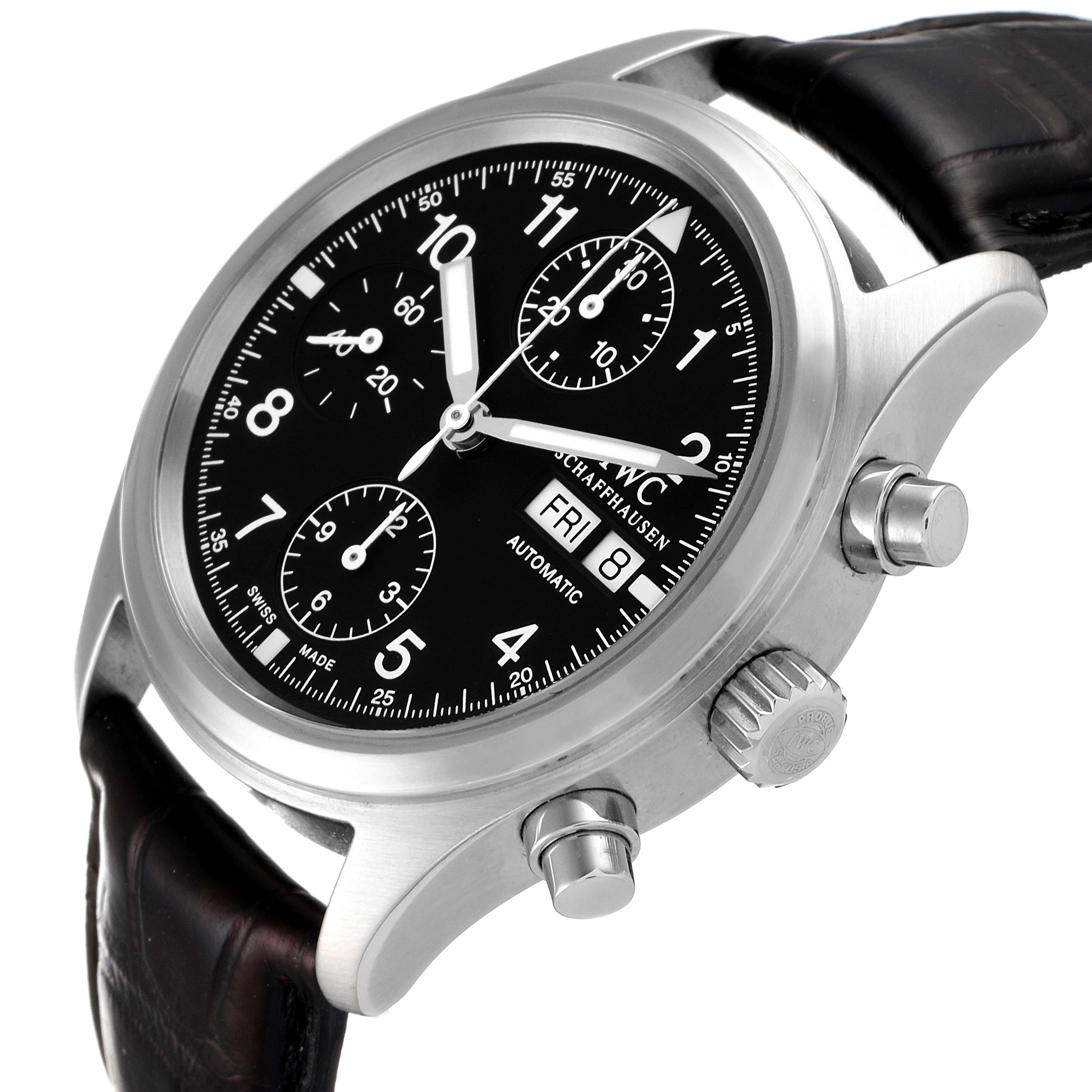 This Pilot model by IWC is shown from a three-quarter angle, highlighting the dial, crown, and two pushers.
