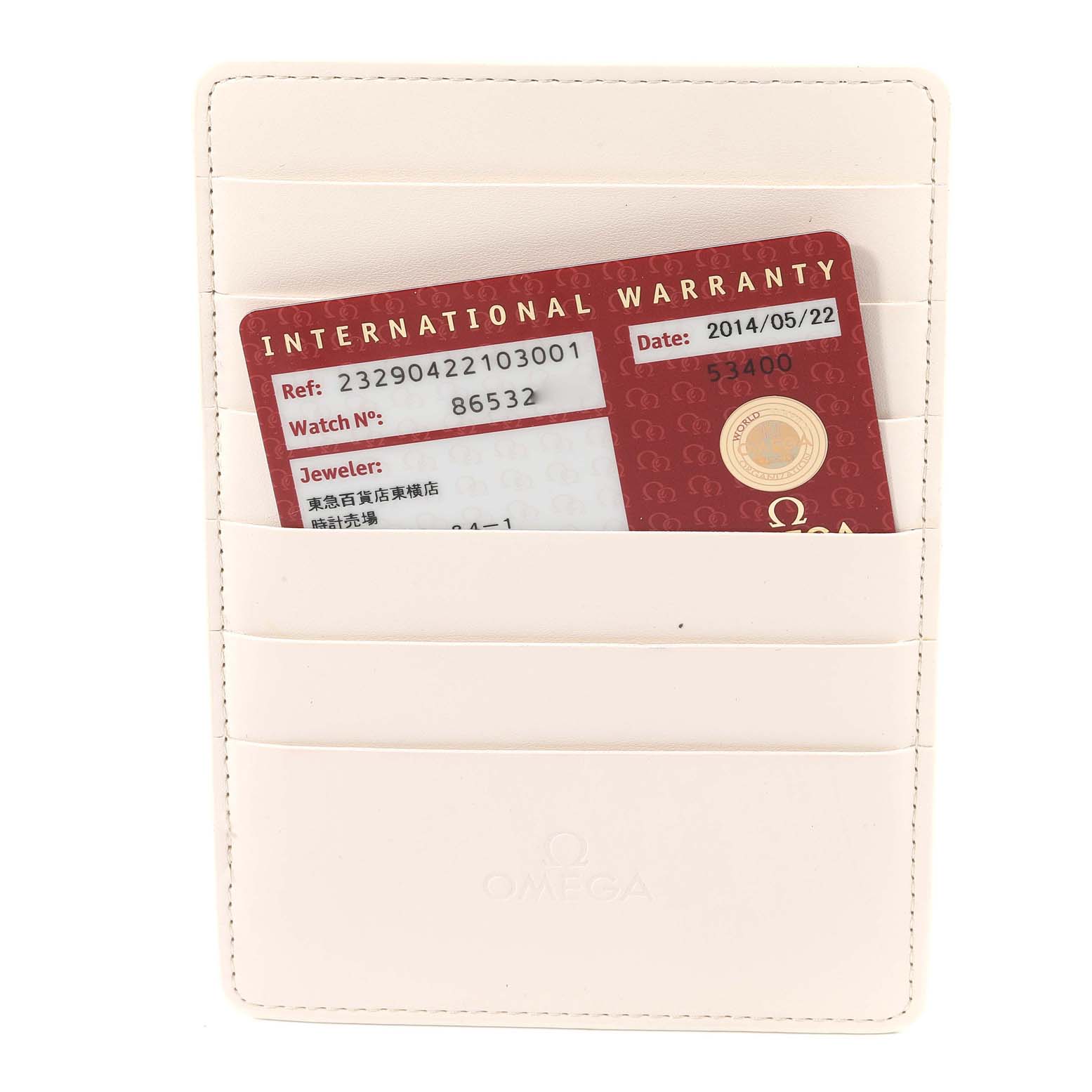 The image shows an Omega international warranty card for the Planet Ocean model, placed inside a white cardholder.