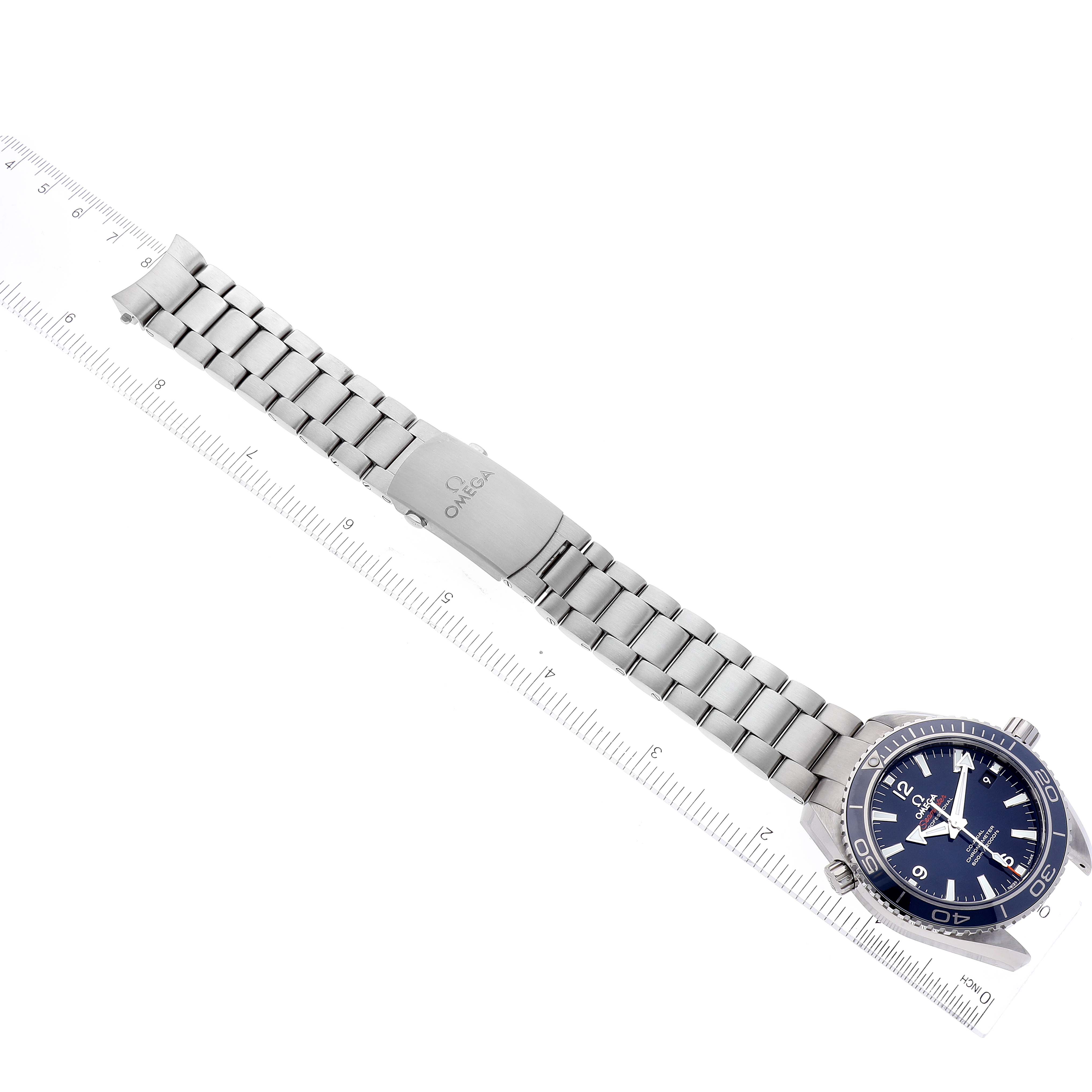 This image shows a top-down view of the Omega Planet Ocean 232.90.42.21.03.001 Men's Titanium Blue Dial 232.90.42.21.03.001 Men's Titanium Blue Dial watch, highlighting its metallic bracelet and clasp.