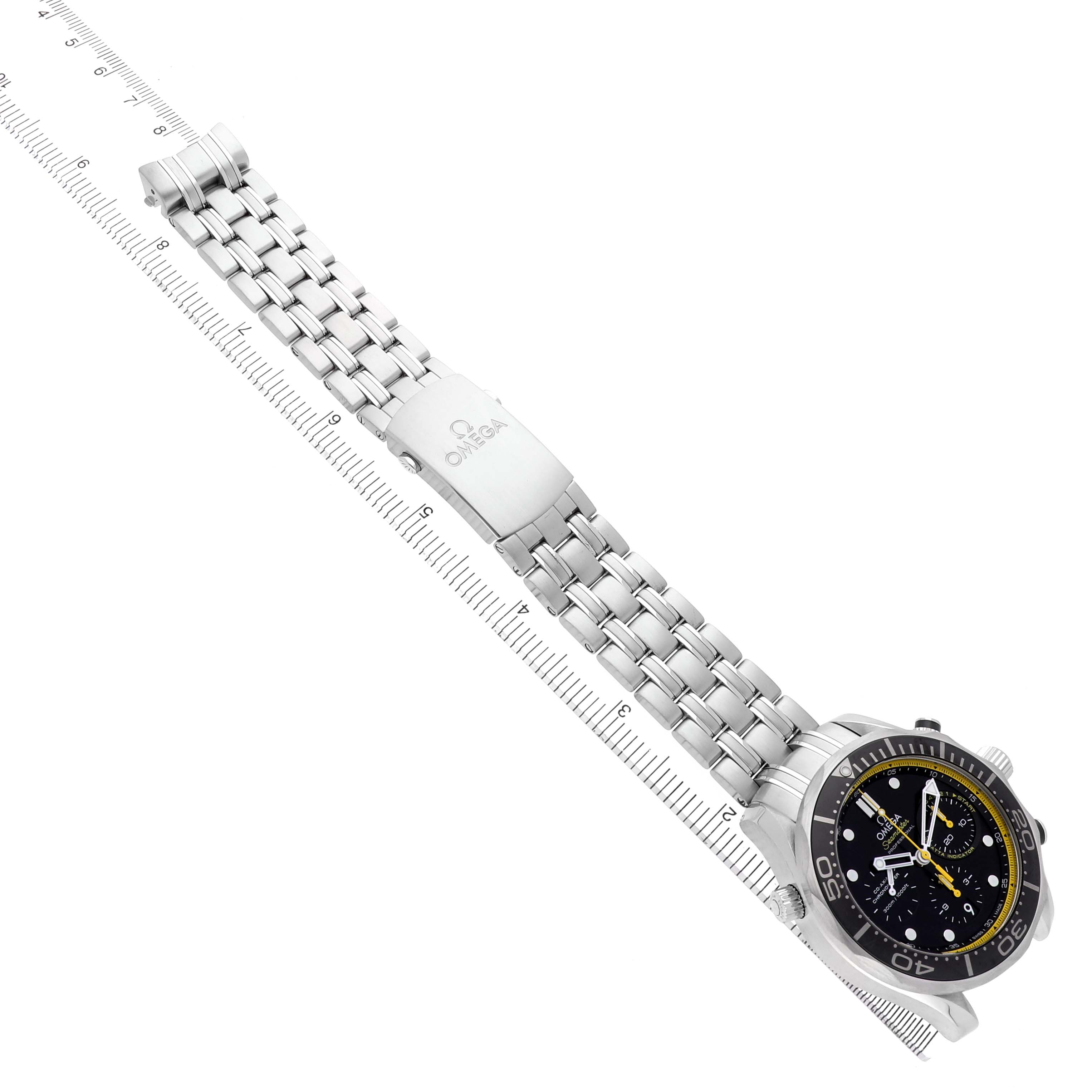 The image shows the Omega Seamaster 212.30.44.50.01.002 Men's Stainless Steel Black Dial watch at an angle highlighting the bracelet, clasp, and face alongside a ruler for scale.