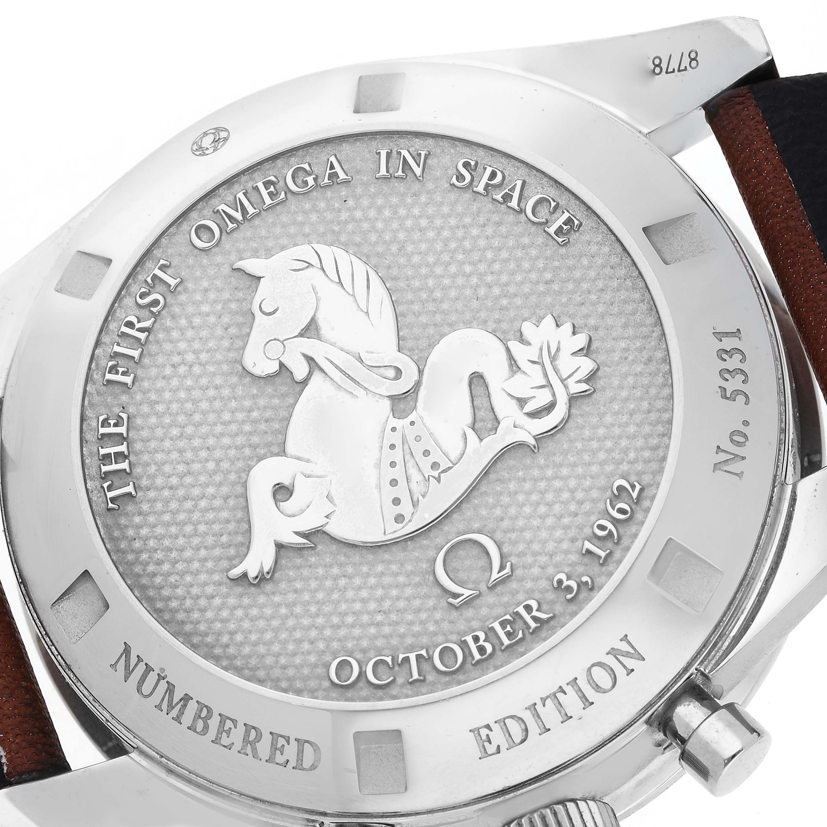 The image shows the case back of the Omega Speedmaster 311.32.40.30.01.001 Men
s Stainless Steel Black Dial 311.32.40.30.01.001 Men
s Stainless Steel Black Dial, featuring an engraved design and commemorative text.