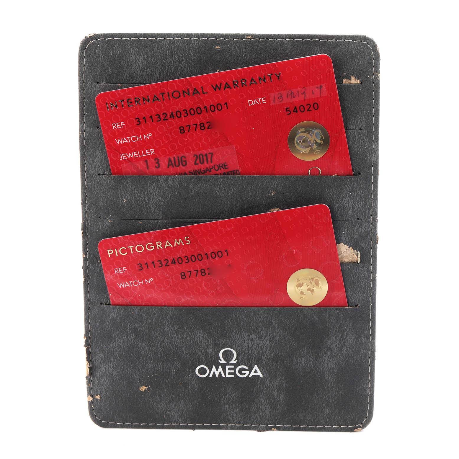 The image shows Omega Speedmaster 311.32.40.30.01.001 Men
s Stainless Steel Black Dial 311.32.40.30.01.001 Men
s Stainless Steel Black Dial
s warranty and pictogram cards in a branded cardholder.