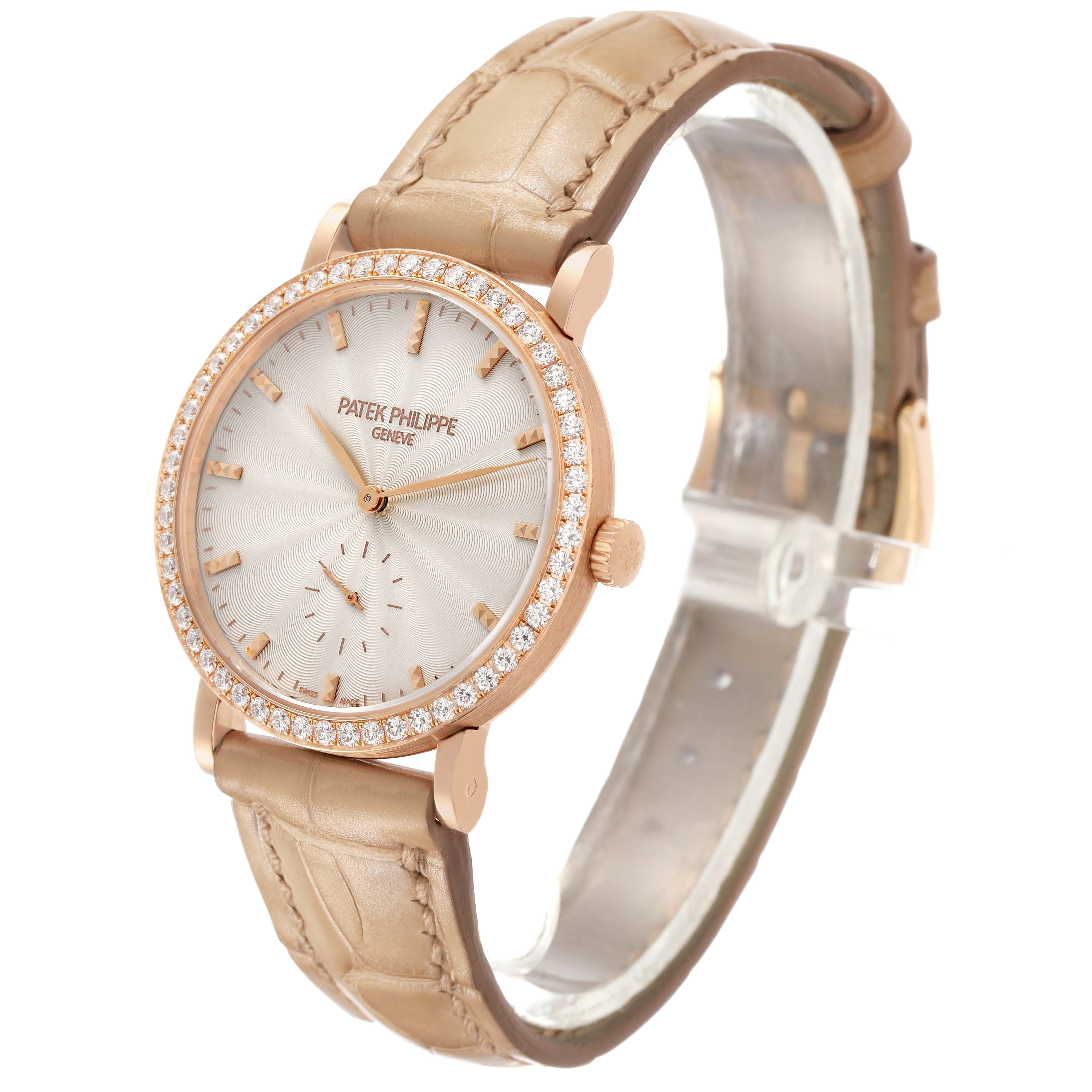 The Patek Philippe Calatrava 7120R-001 Women's Rose Gold Beige Dial watch is shown at a three-quarter angle, highlighting the dial, diamond-set bezel, crown, and leather strap.