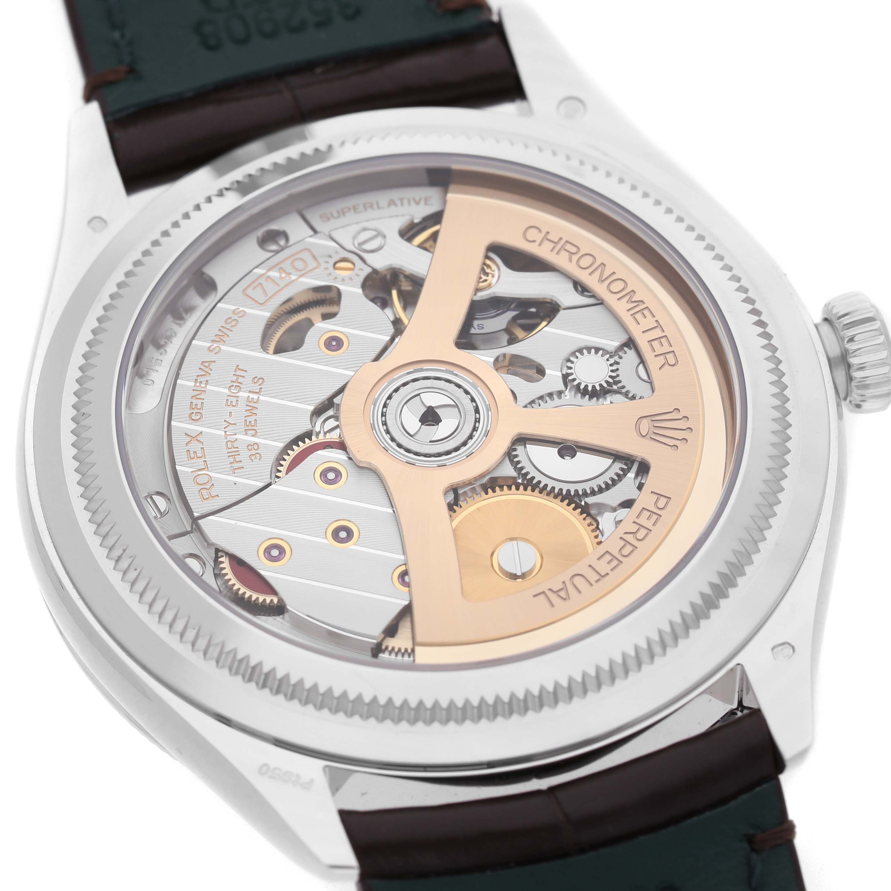 The image shows the back view of a Rolex 1908 52506 Men's Platinum Blue Dial model, highlighting its intricate movement and rotor.