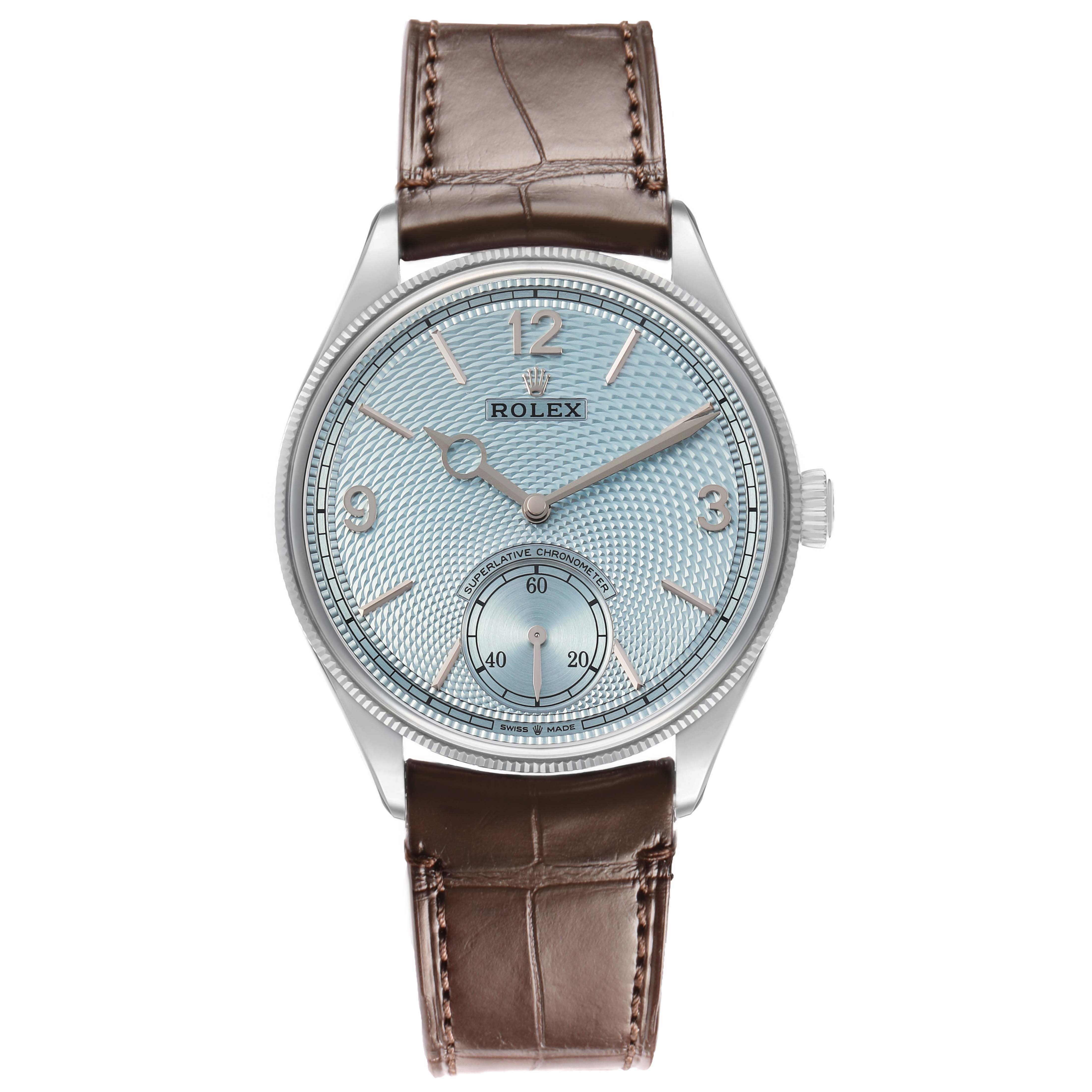 The 1908 Rolex watch is shown from a frontal angle, displaying the face, crown, case, and leather strap.
