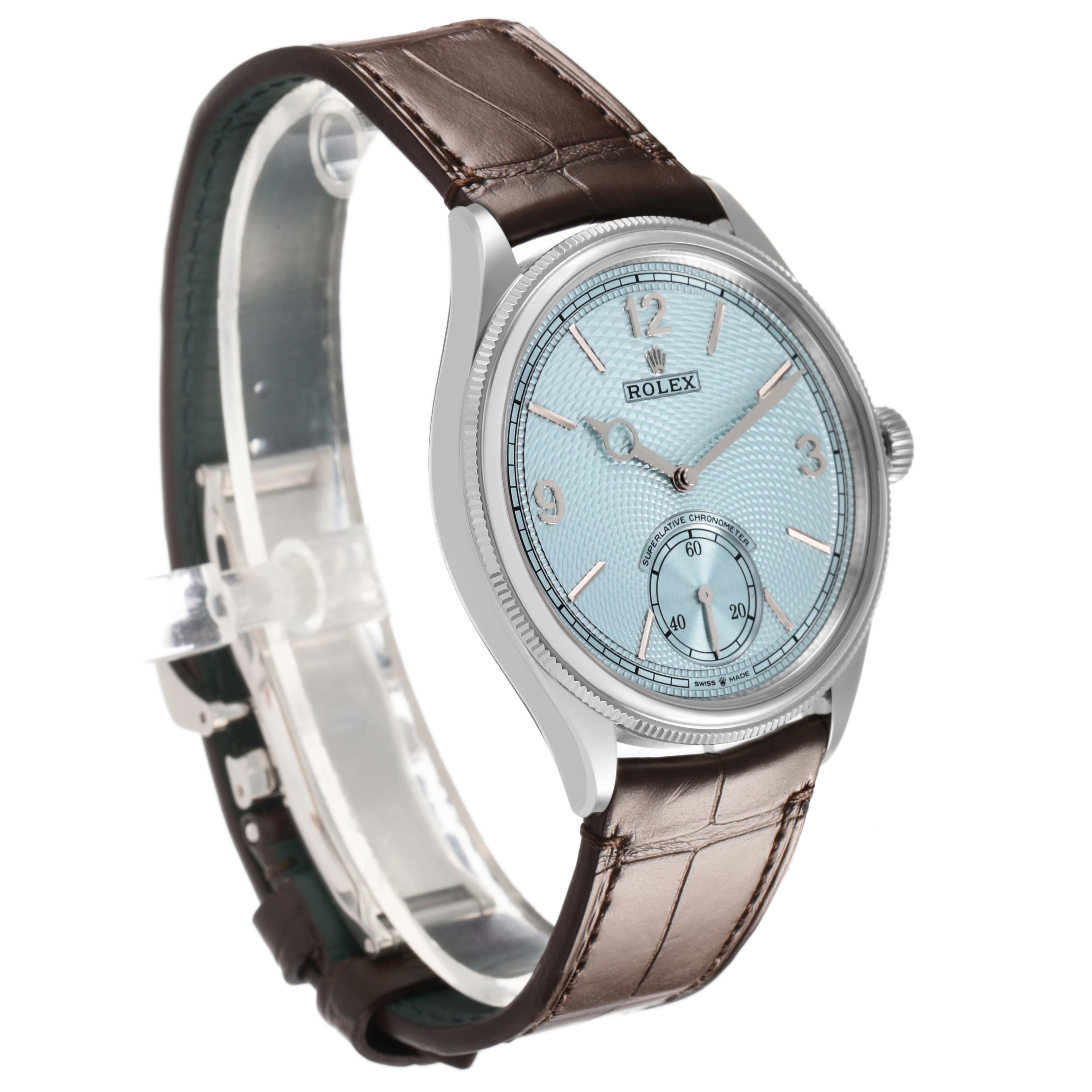 The Rolex 1908 52506 Men's Platinum Blue Dial model is shown from a side angle, highlighting the dial, bezel, and part of the leather strap.