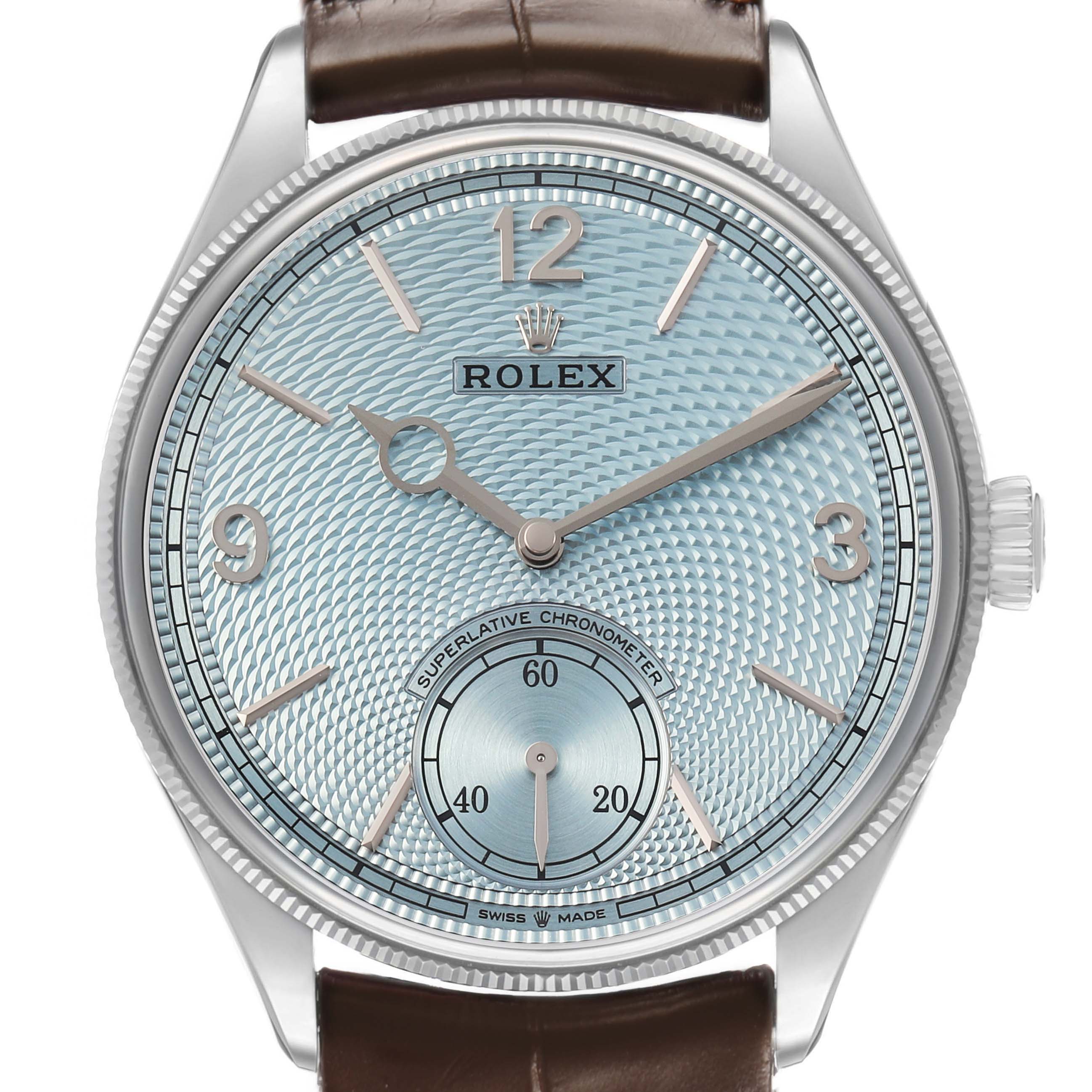 The Rolex 1908 52506 Men's Platinum Blue Dial model is shown from the front, displaying its dial, hands, brand logo, and part of the leather strap.
