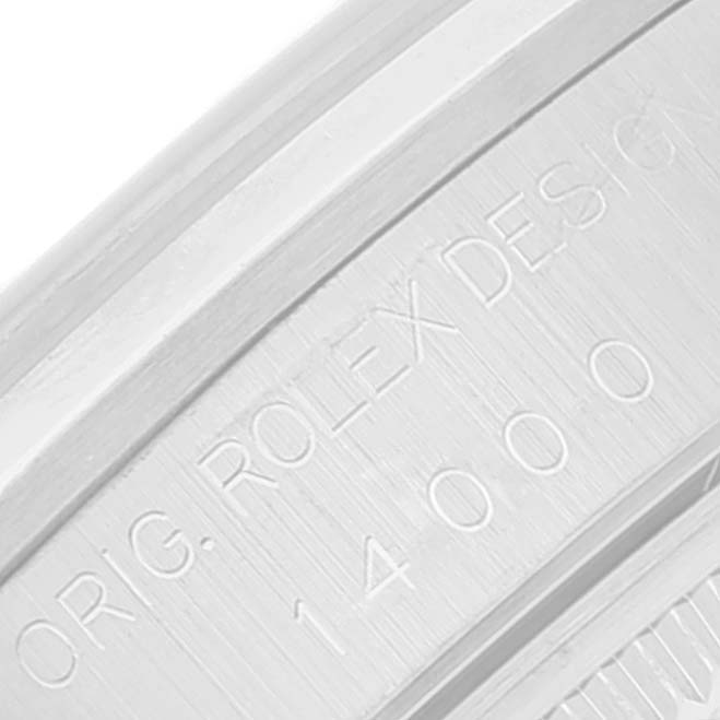 This close-up image shows the engraved text on the case back of a Rolex Air-King 14000 Men's Stainless Steel Blue Dial 14000 Men's Stainless Steel Blue Dial watch.