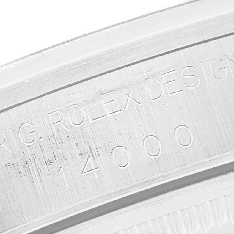 This image shows a close-up of the engraved serial number and branding on the bezel of the Rolex Air-King 14000 Men's Stainless Steel White Dial 14000 Men's Stainless Steel White Dial watch.