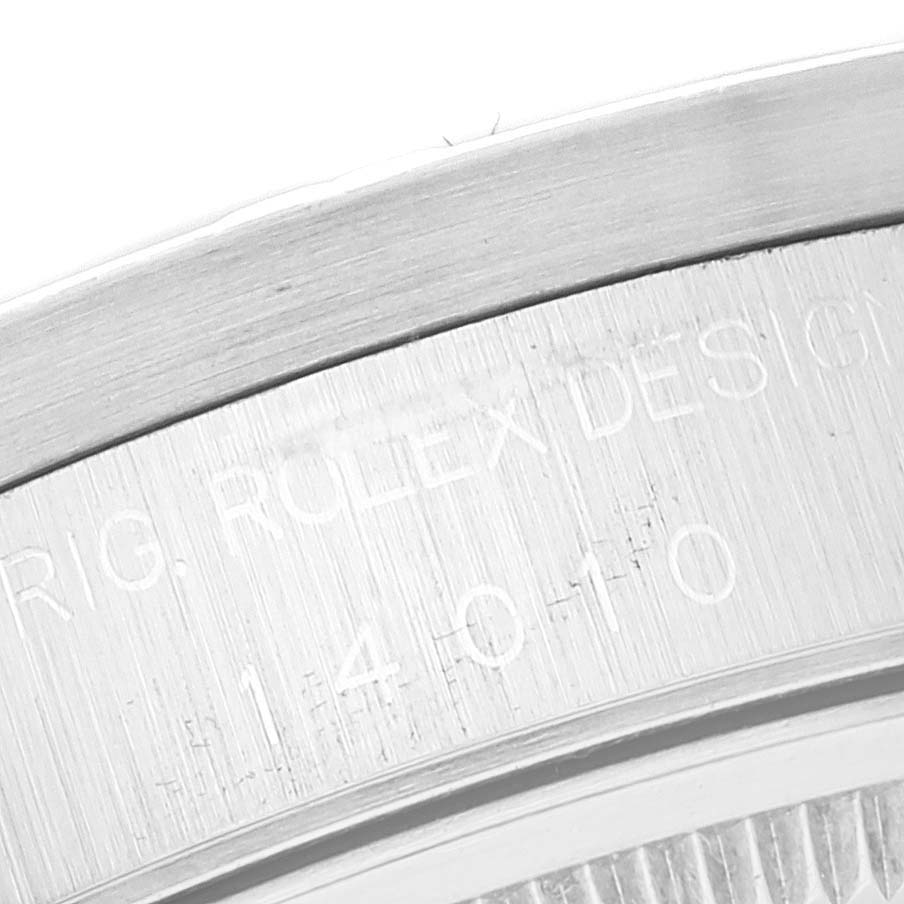 The image shows a close-up of the case back and edge of the bezel on a Rolex Air-King 14010 Men's Stainless Steel White Dial 14010 Men's Stainless Steel White Dial watch, highlighting engraving details.