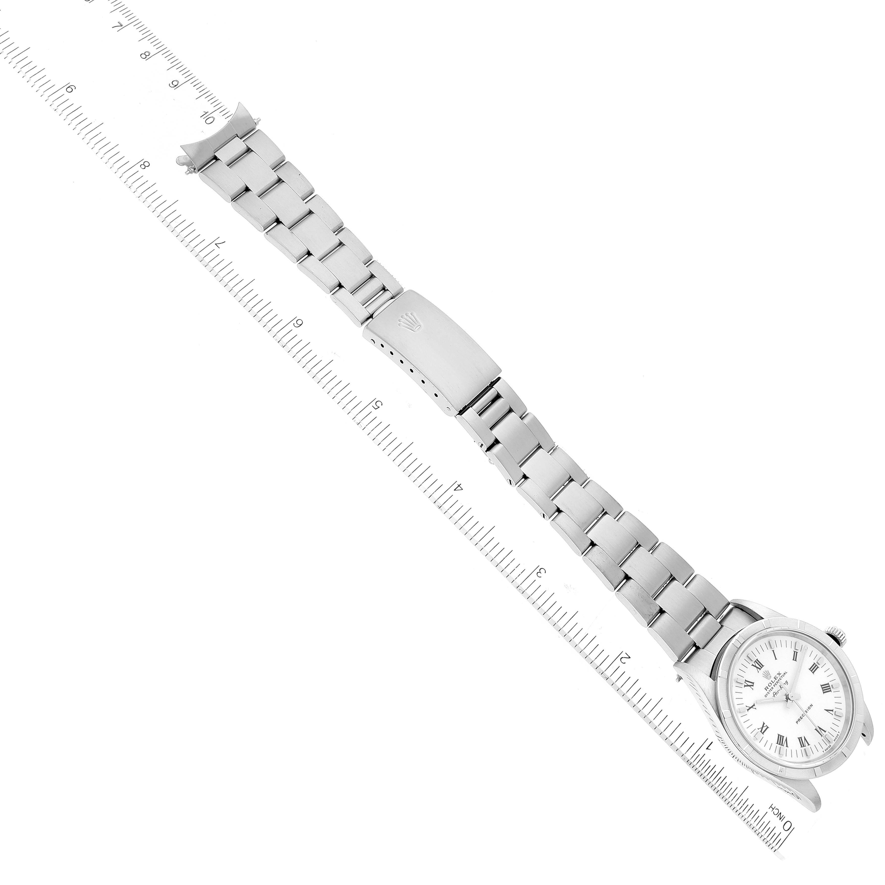 The image shows a Rolex Air-King 14010 Men's Stainless Steel White Dial 14010 Men's Stainless Steel White Dial watch laying flat with the face, bracelet, clasp, and part of the crown visible, aligned with a ruler.