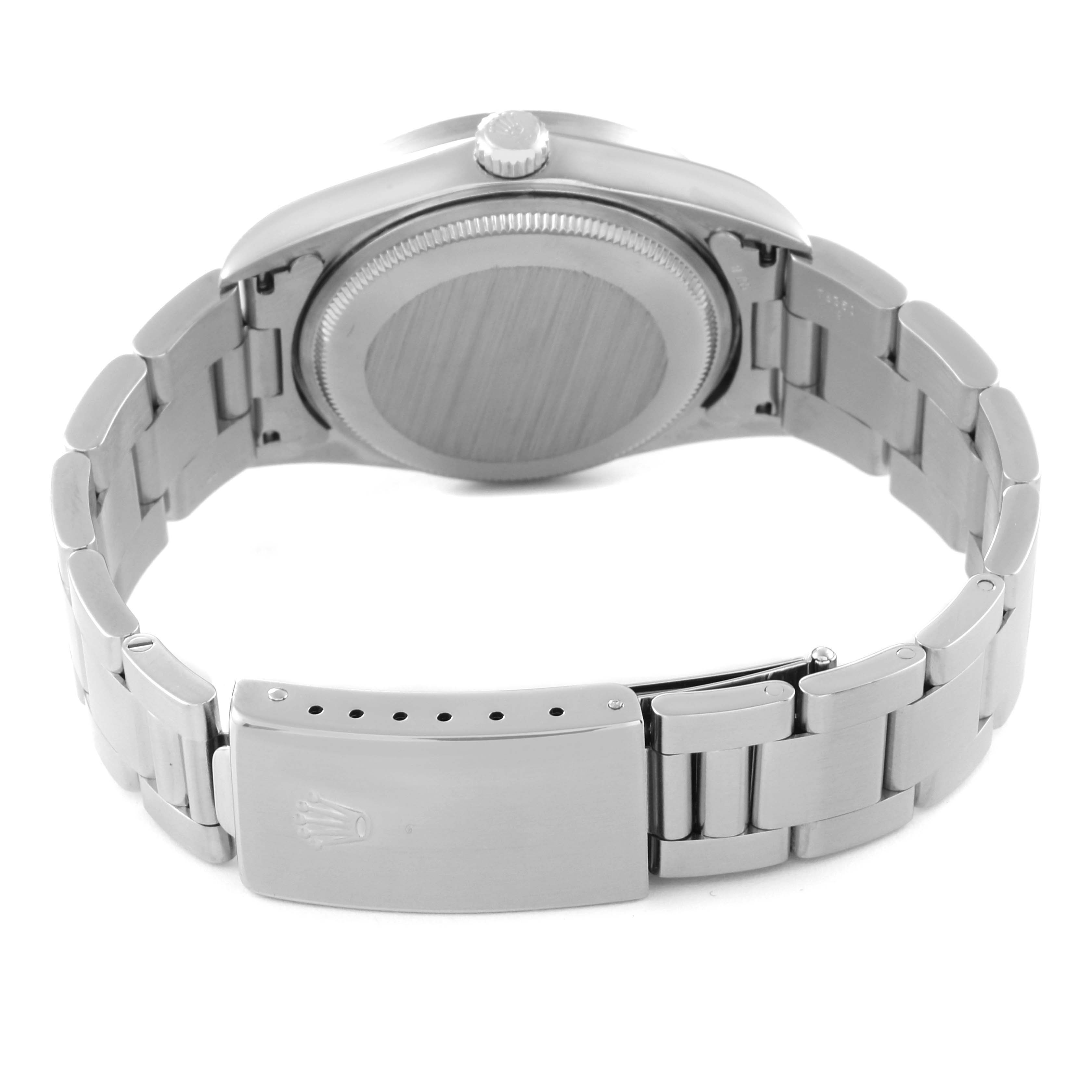 The Rolex Air-King 14010 Men's Stainless Steel Silver Dial 14010 Men's Stainless Steel Silver Dial watch is shown from a rear angle, highlighting the case back, bracelet, and clasp.